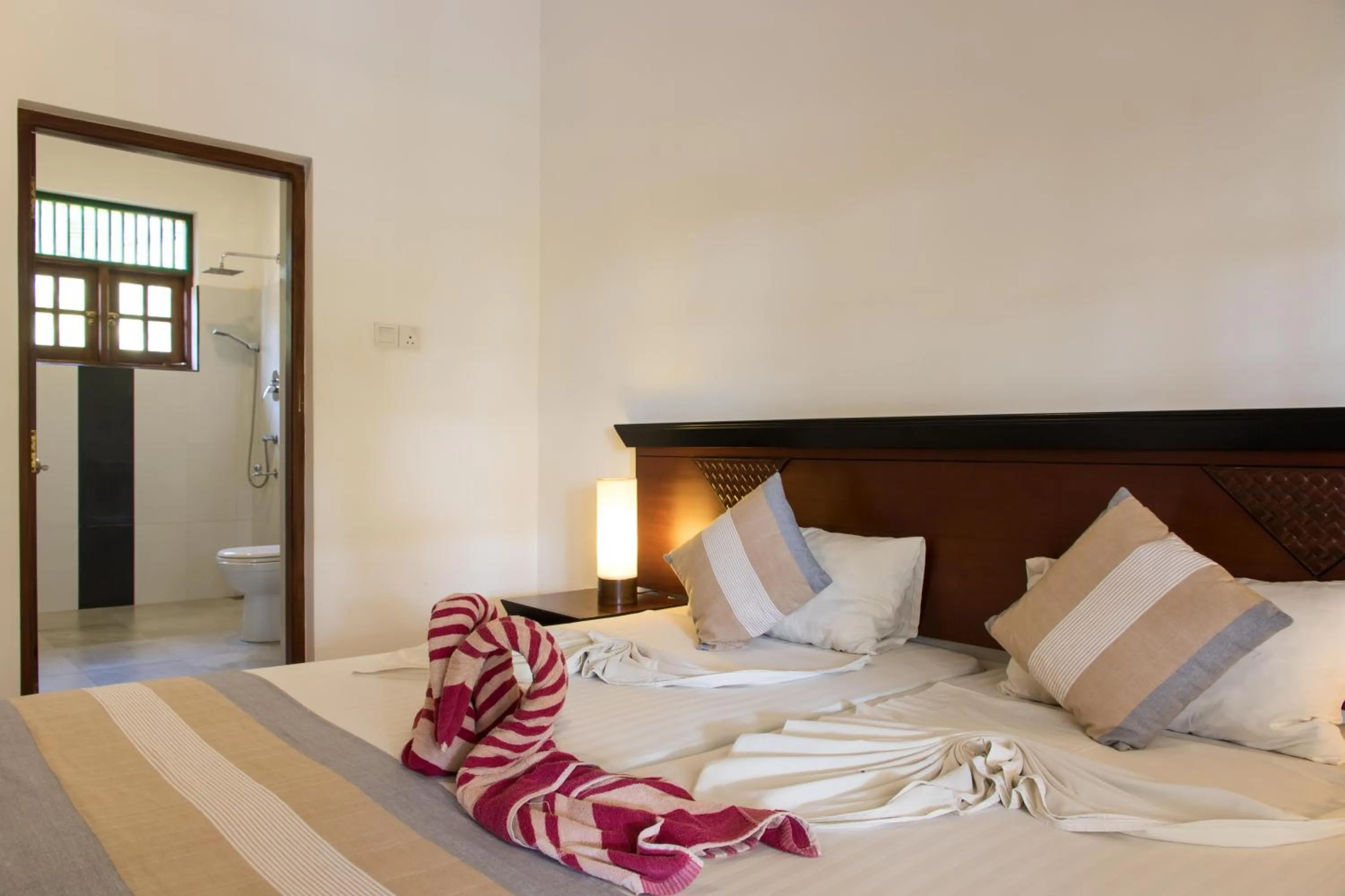 Bedroom, Bed in The Coconut Gardens Hotel & Restaurant