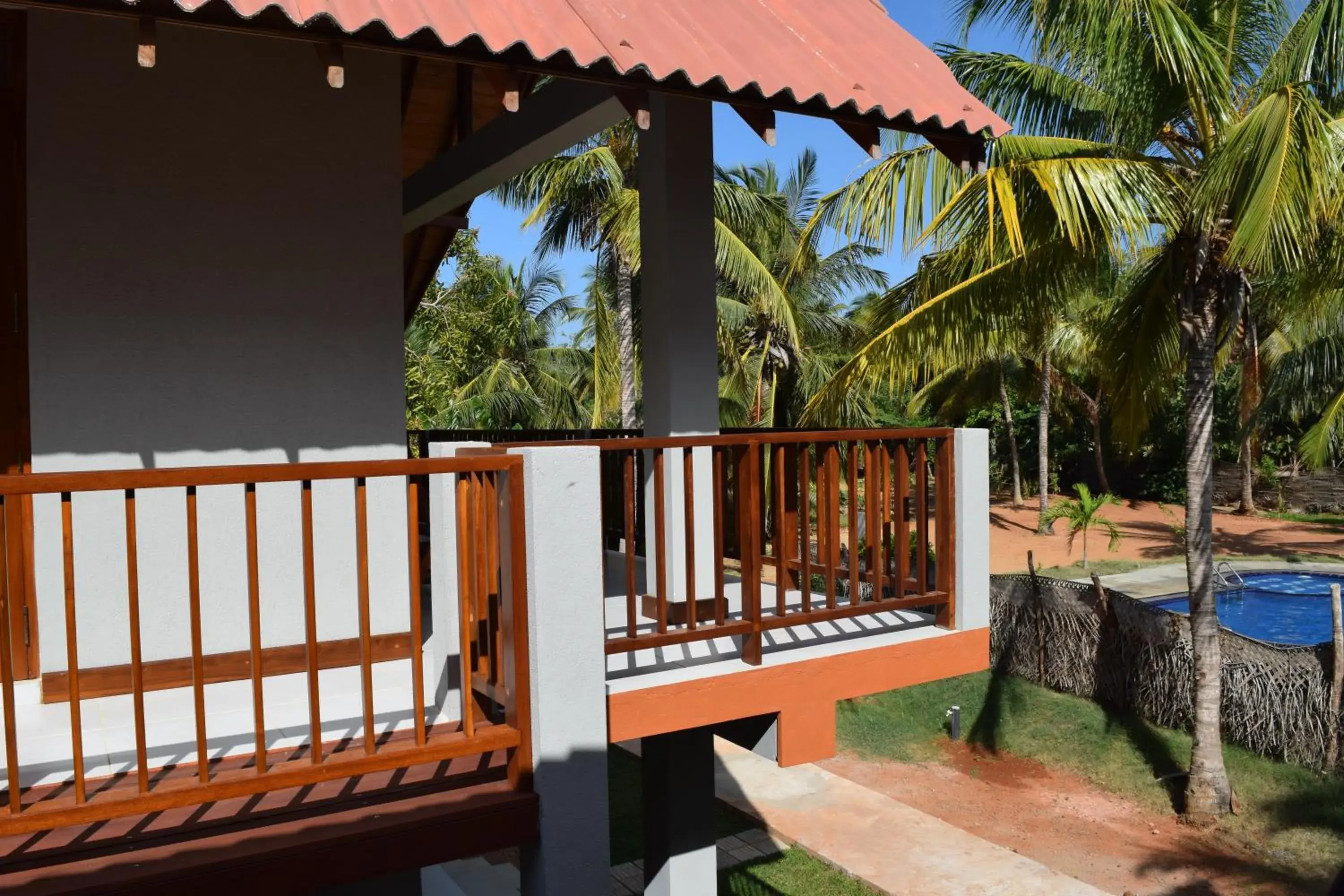 Triple Room with Pool View in The Coconut Gardens Hotel & Restaurant Triple Room with Pool View in The Coconut Gardens Hotel & Restaurant