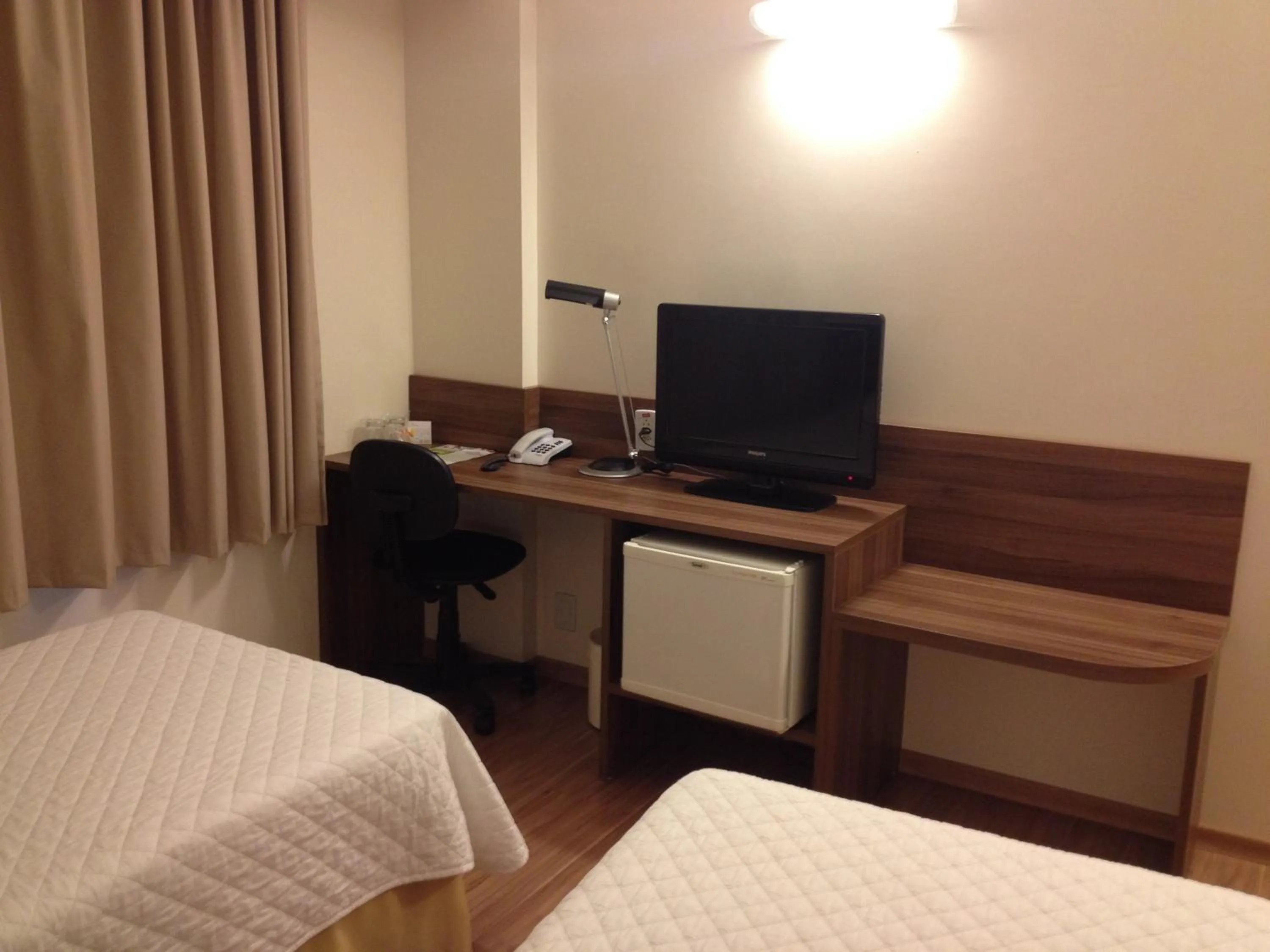 Decorative detail, Bed in Mogano Business Hotel- ELETROPOSTO