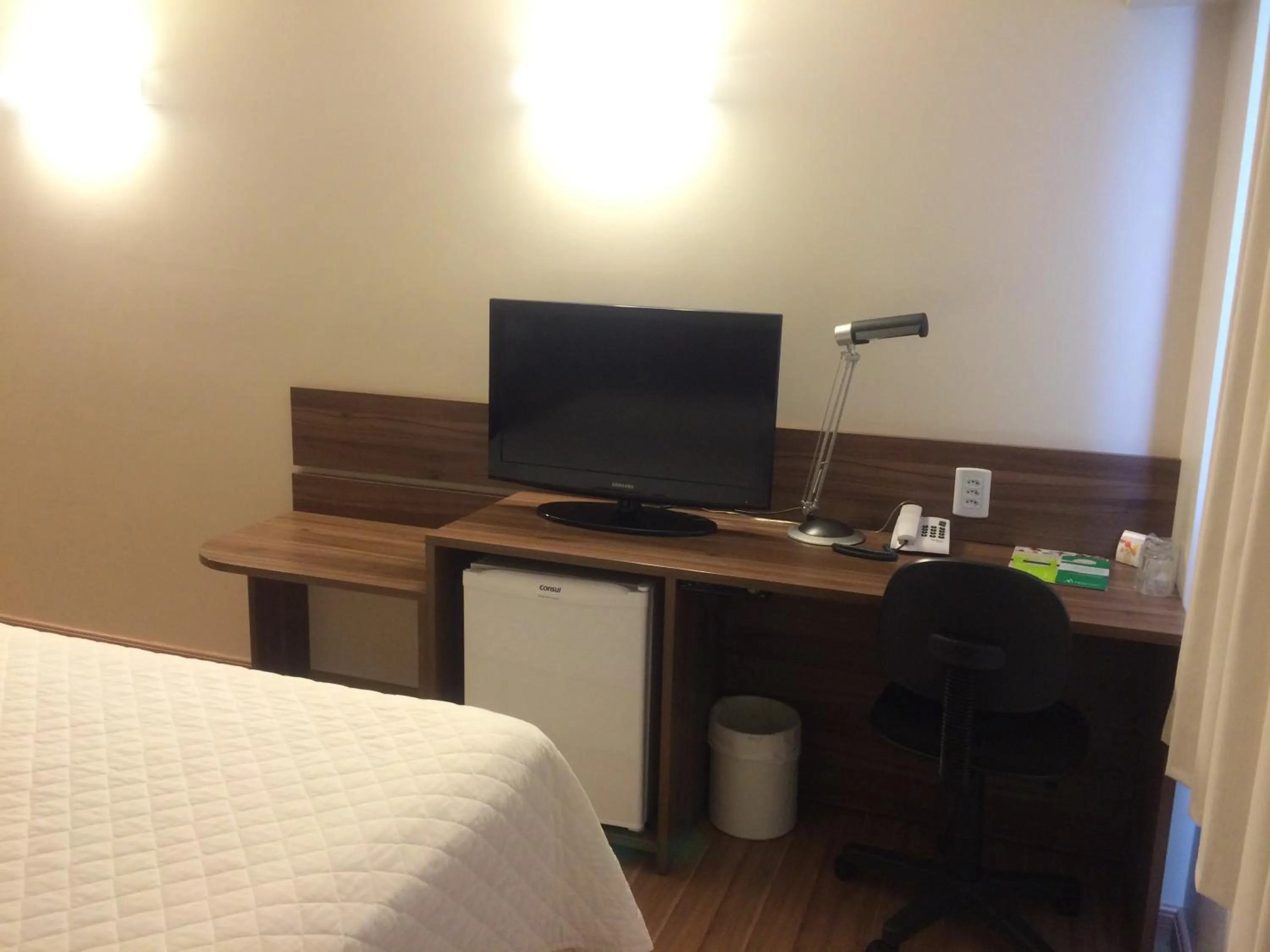 Decorative detail, Bed in Mogano Business Hotel- ELETROPOSTO