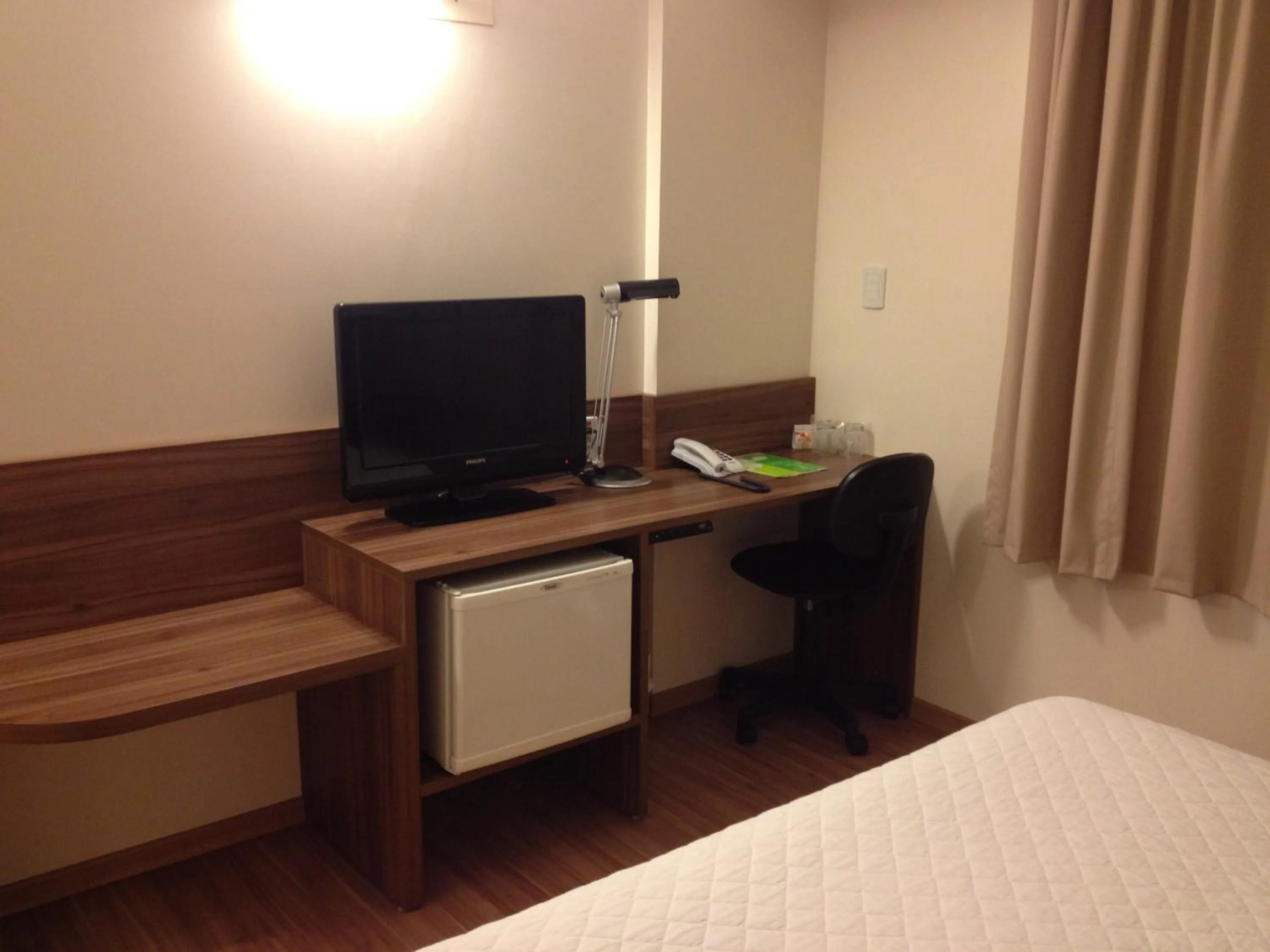 Decorative detail, Bed in Mogano Business Hotel- ELETROPOSTO