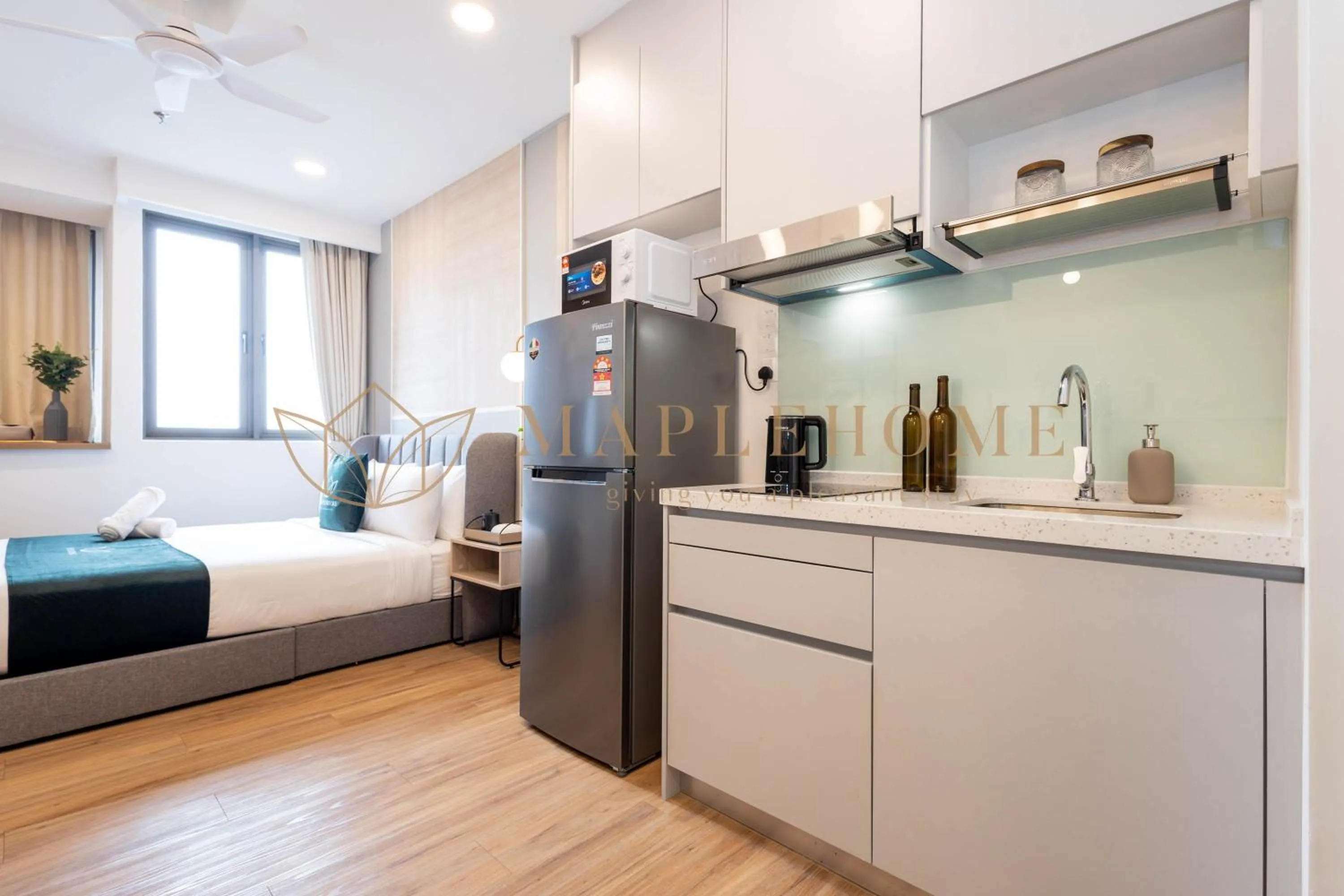 Kitchen or kitchenette, Bed in Riveria Premier Suites Kuala Lumpur
