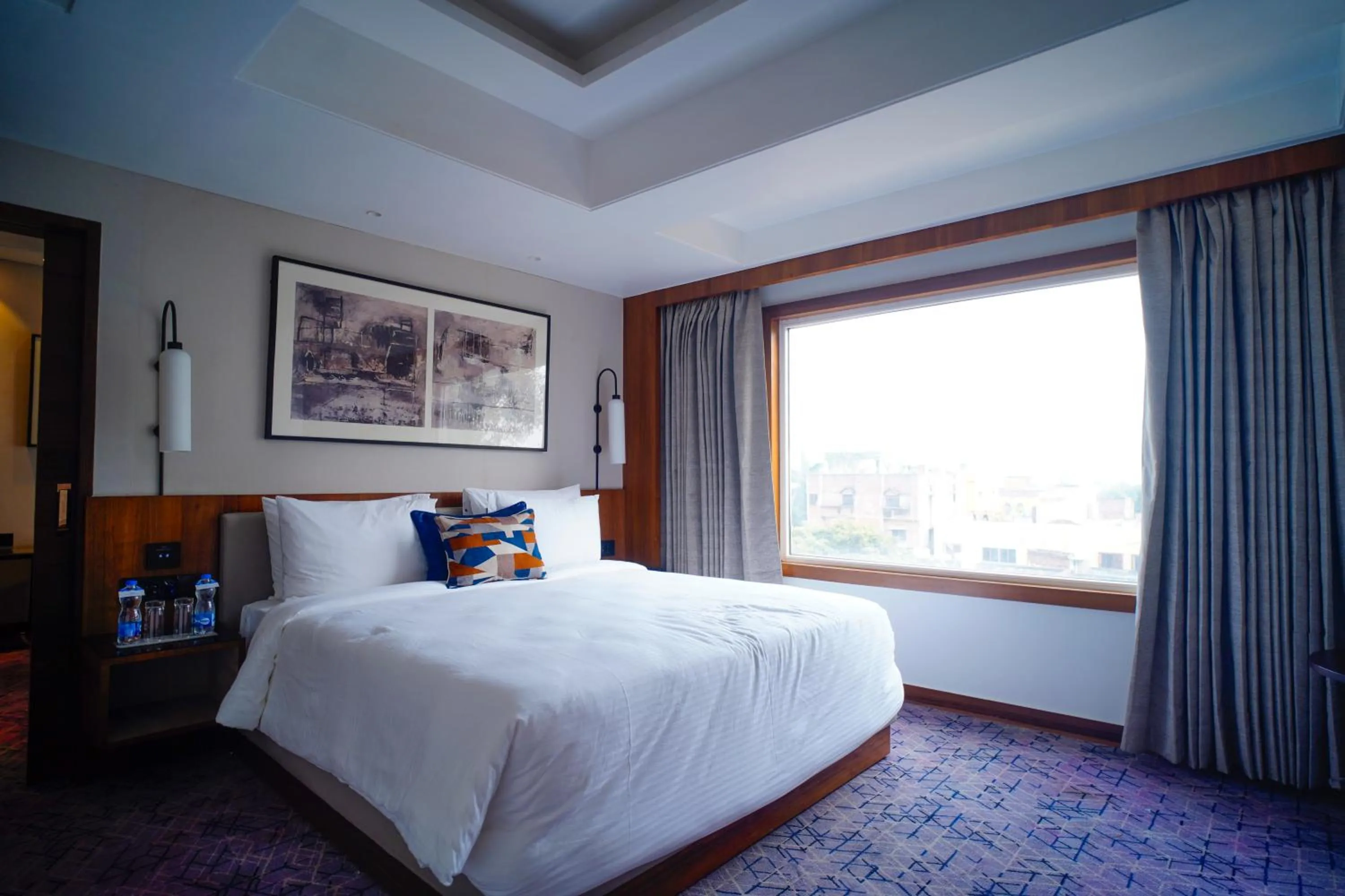 Bed in Ishaan Sarovar Portico Deoghar