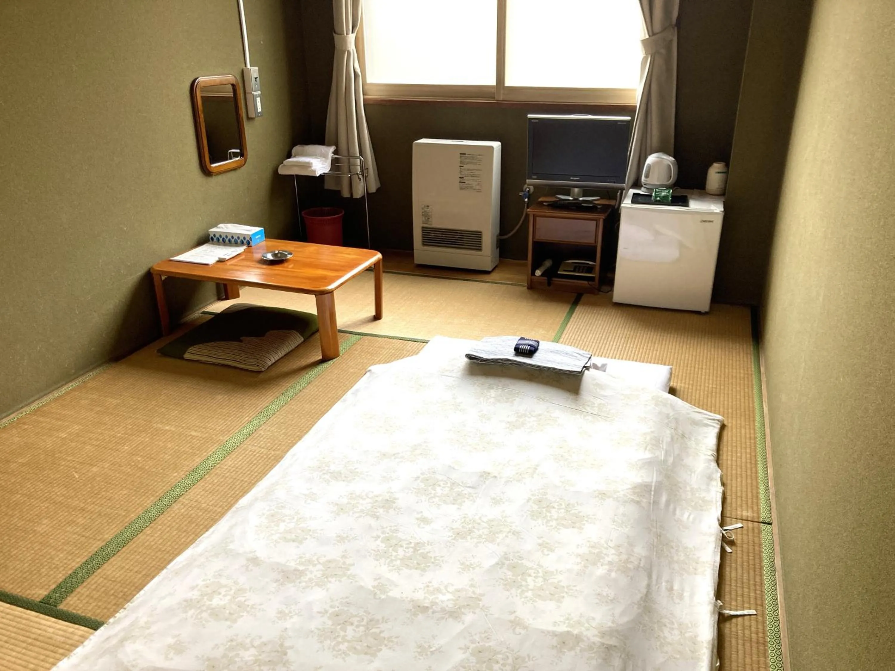 Bed in Hotel Tetora Yunokawaonsen