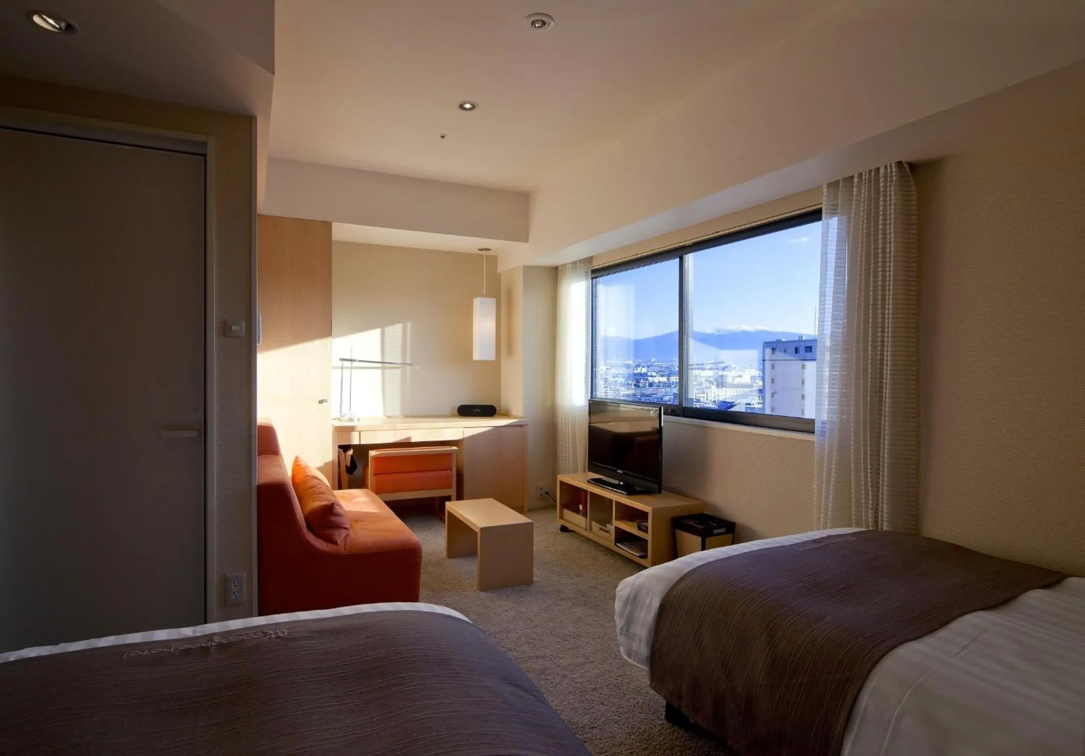 Seating area, Bed in Cocochee Hotel Numazu