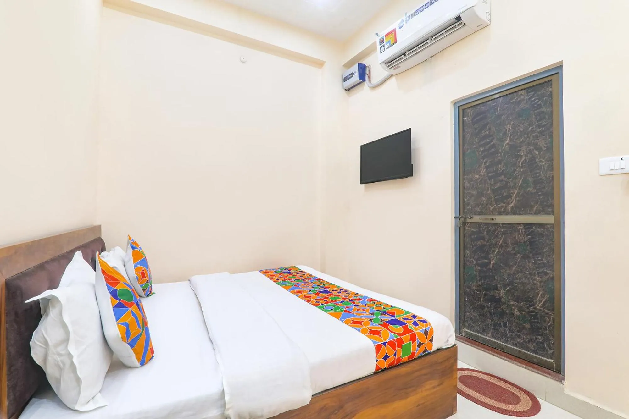 Bed in FabHotel RK Palace