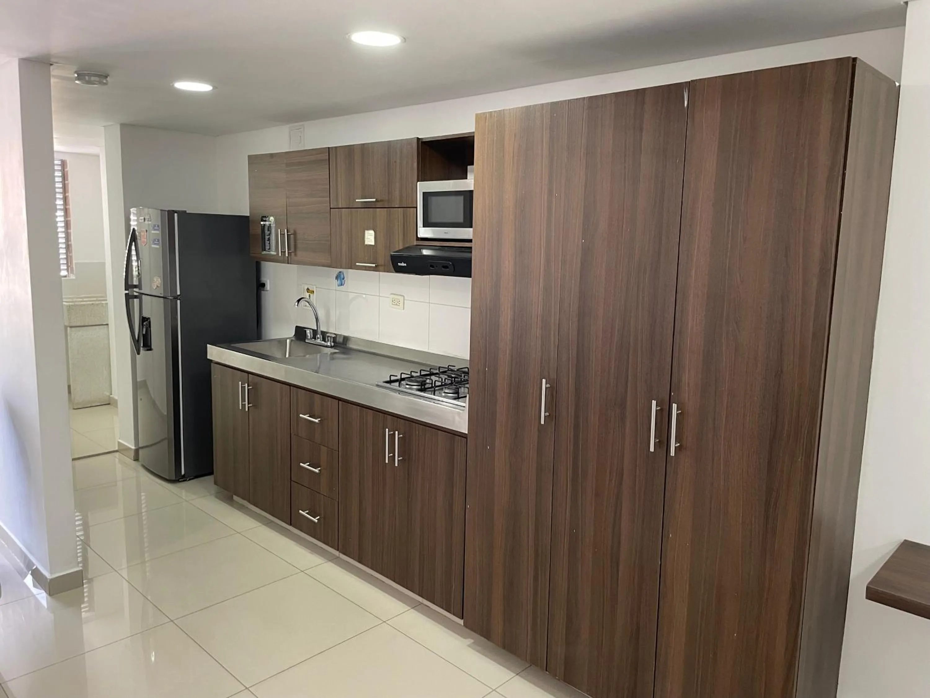 Kitchen or kitchenette in Ivanna Jumar ApartaHotel - Laureles Estadio