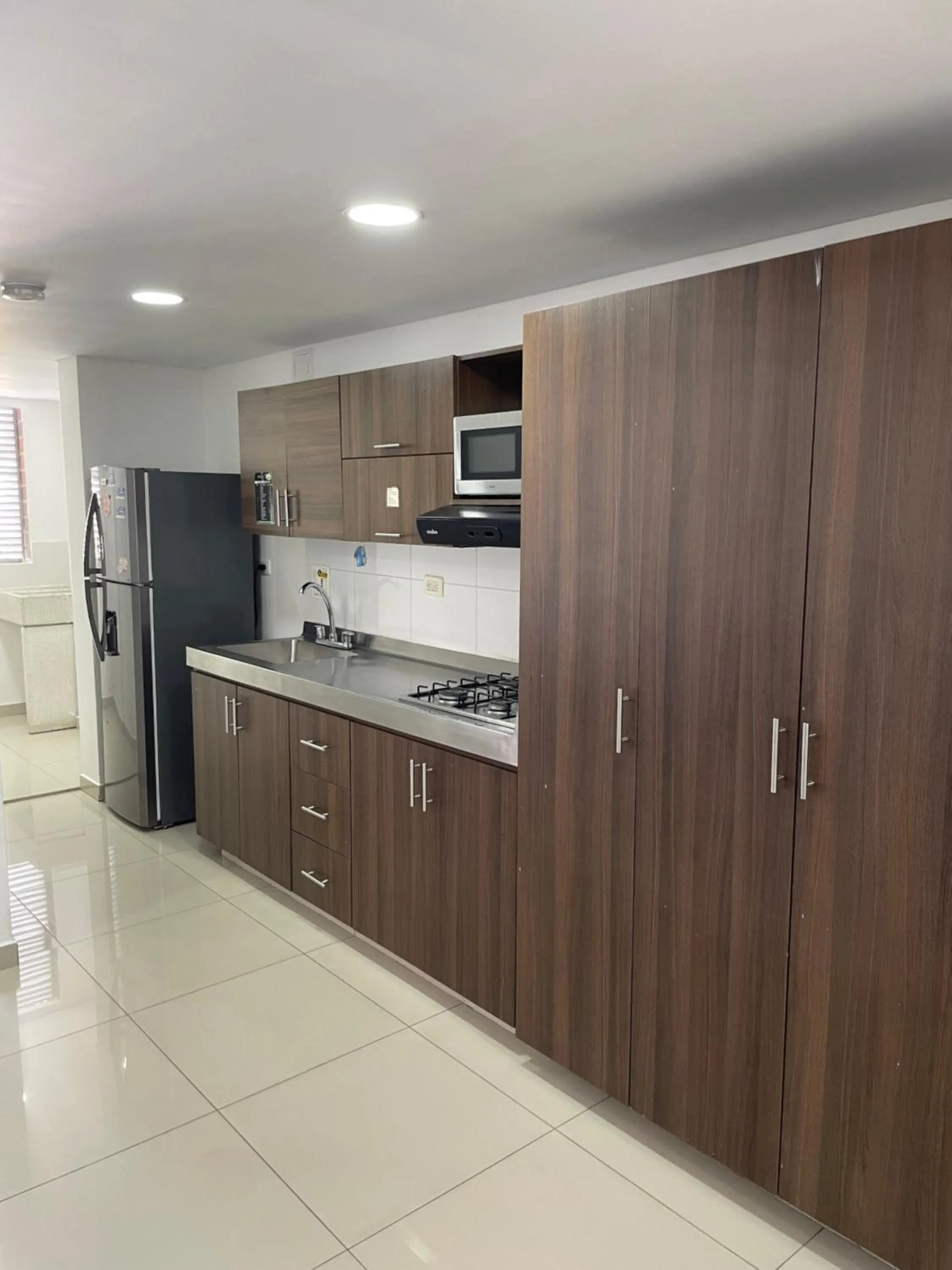 Kitchen or kitchenette in Ivanna Jumar ApartaHotel - Laureles Estadio