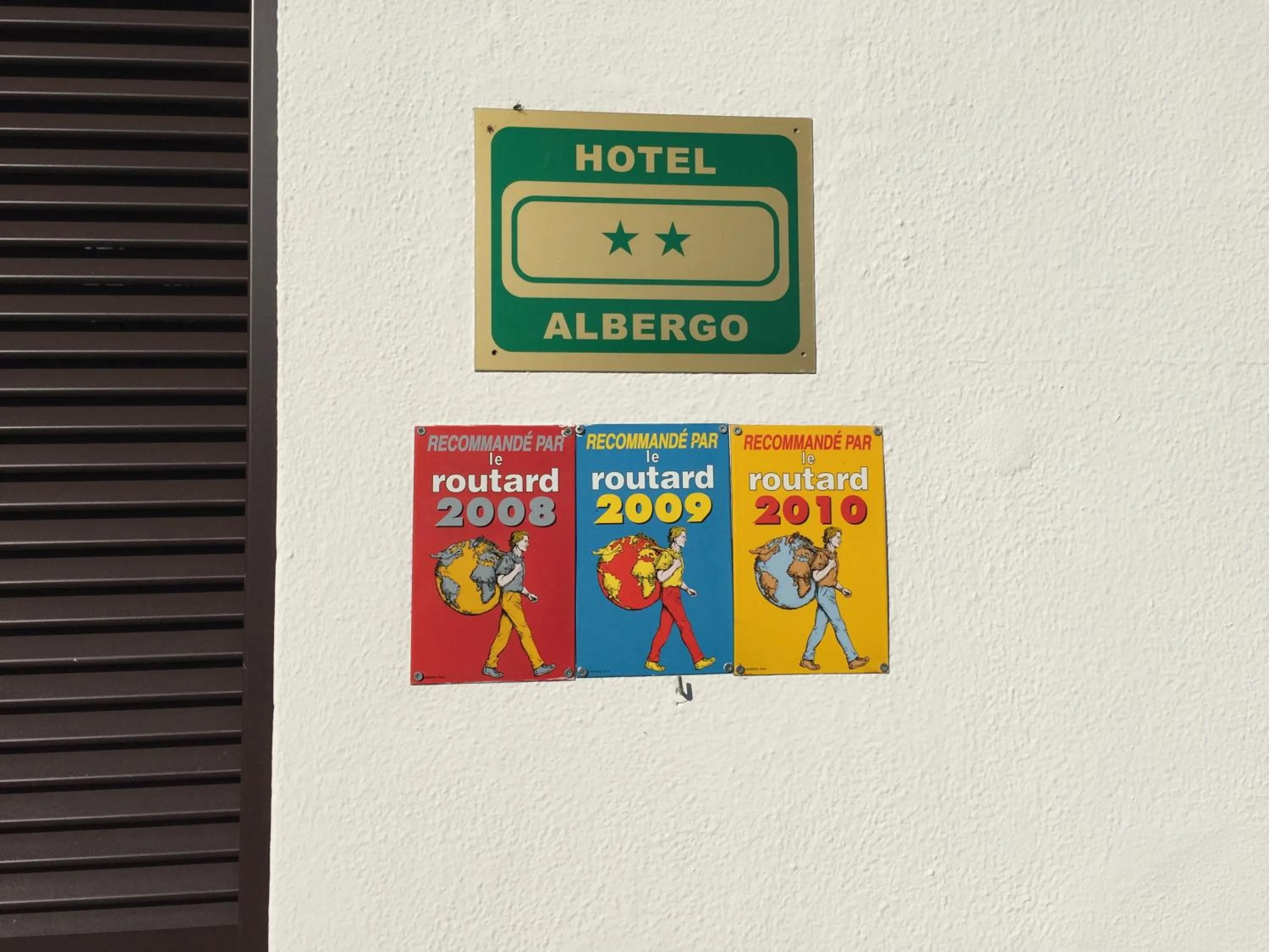 Property logo or sign in Hotel Plinio