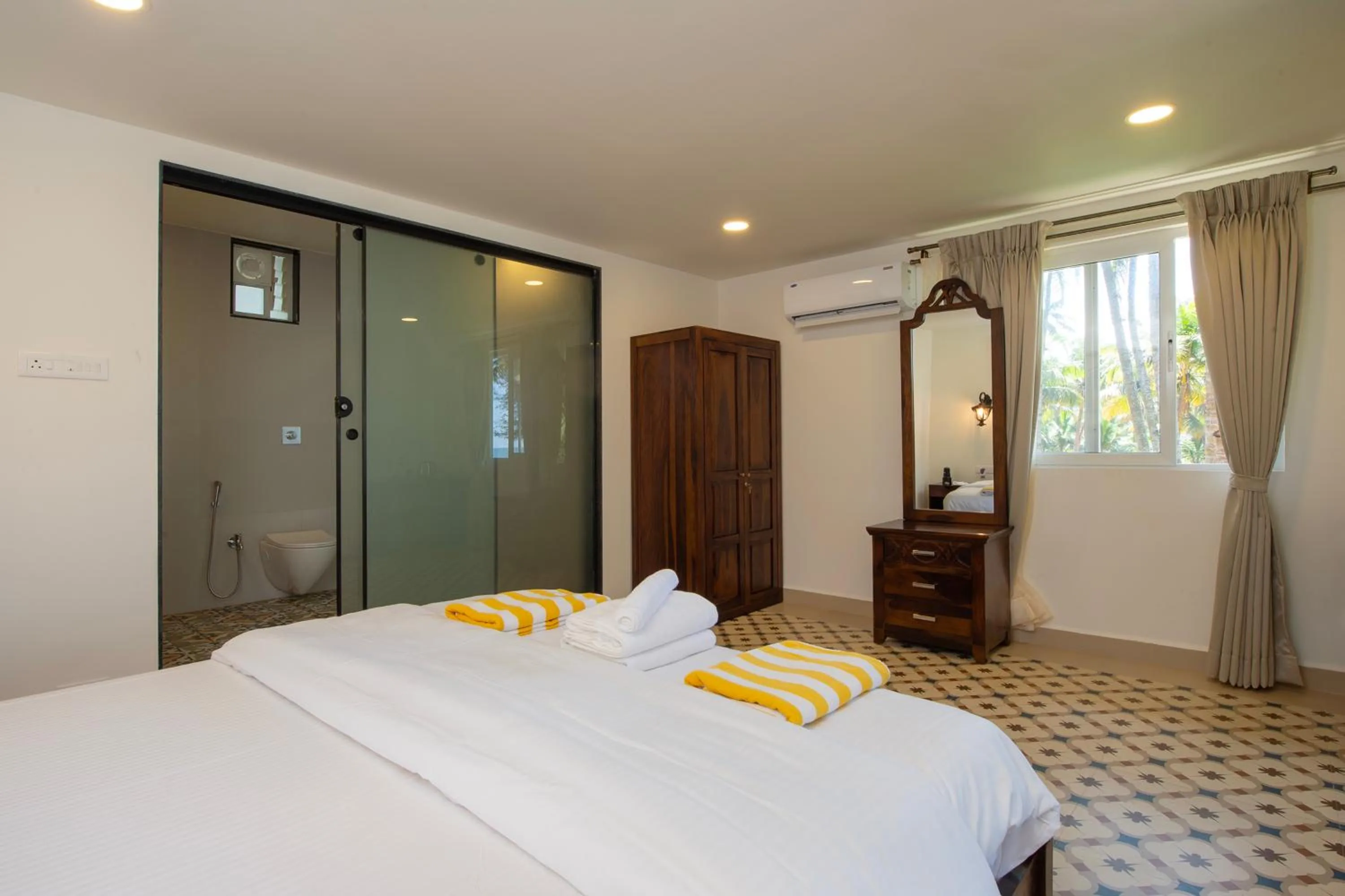 Bathroom, Bed in The Rose Goa Beach Resort