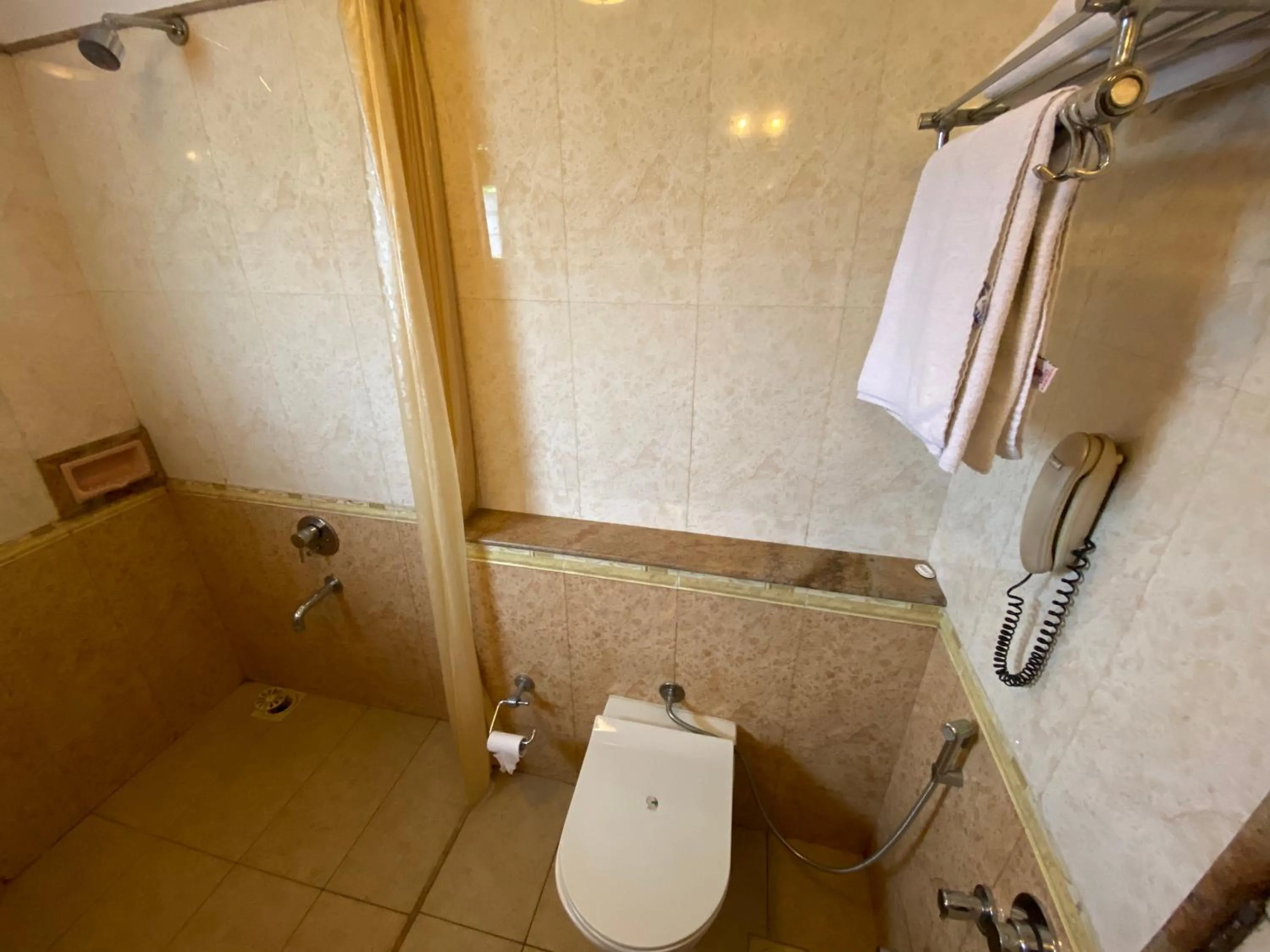 Bathroom in Panchavati Elite Inn