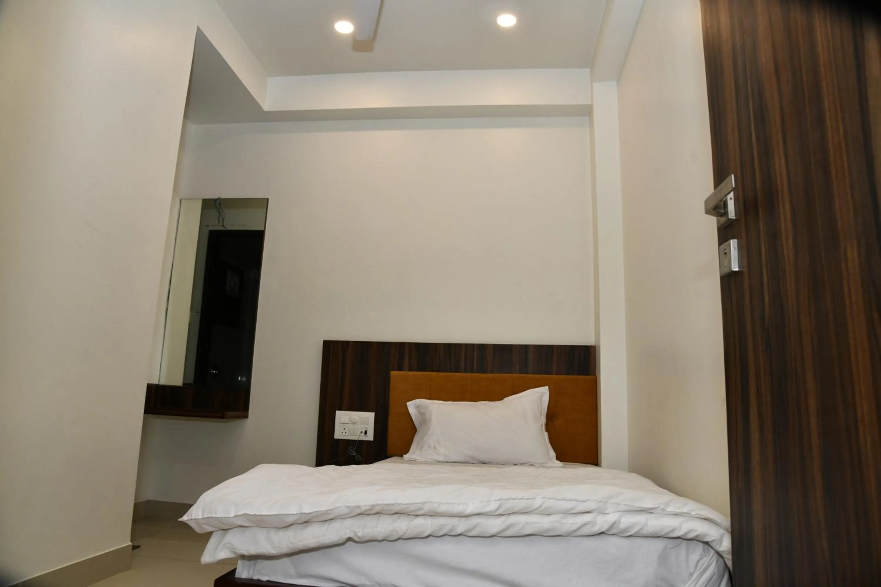 Bed in Hotel Shreeji Palace