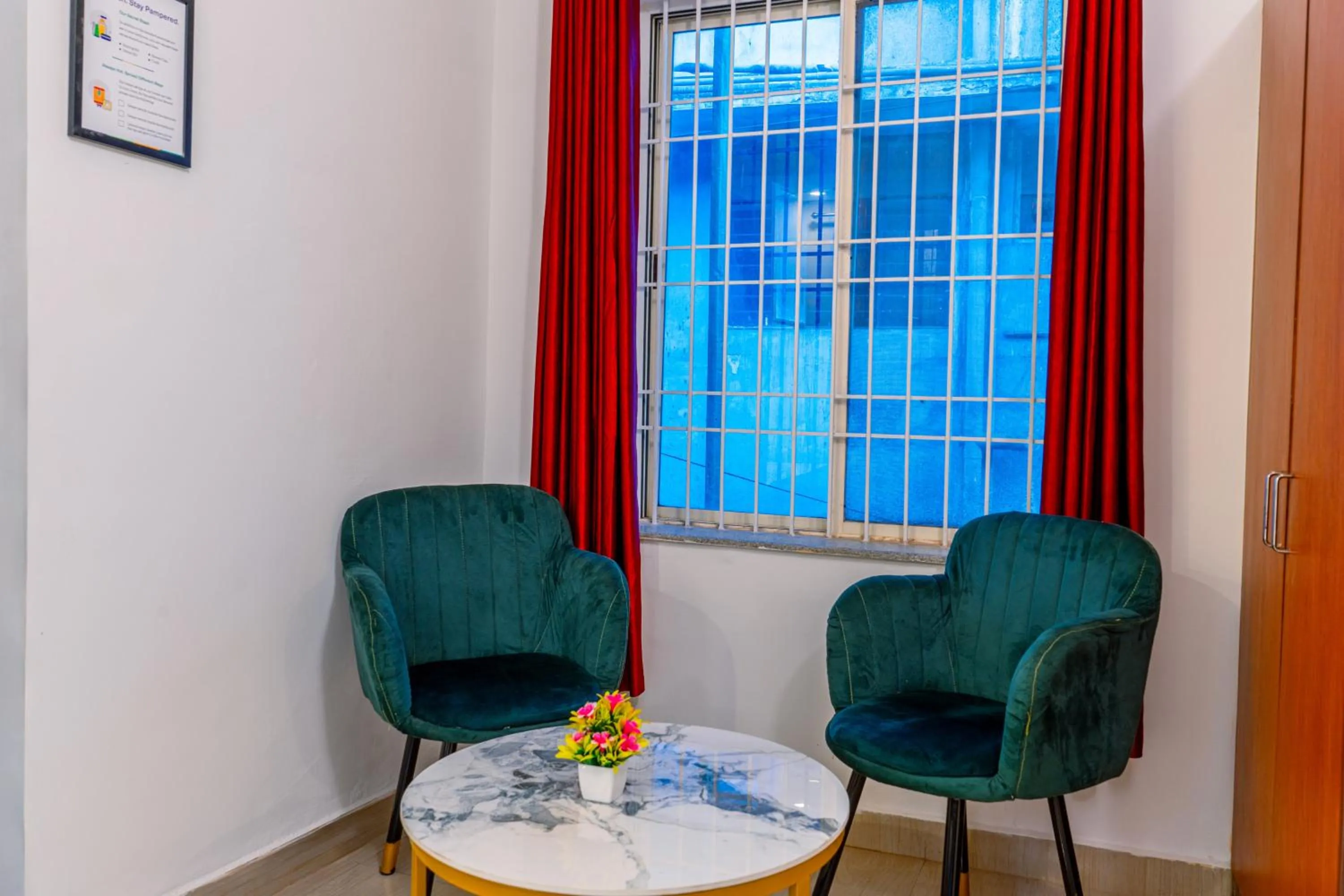 Seating area in Treebo Regalia Comforts, 15 Mins From Abbey Waterfall