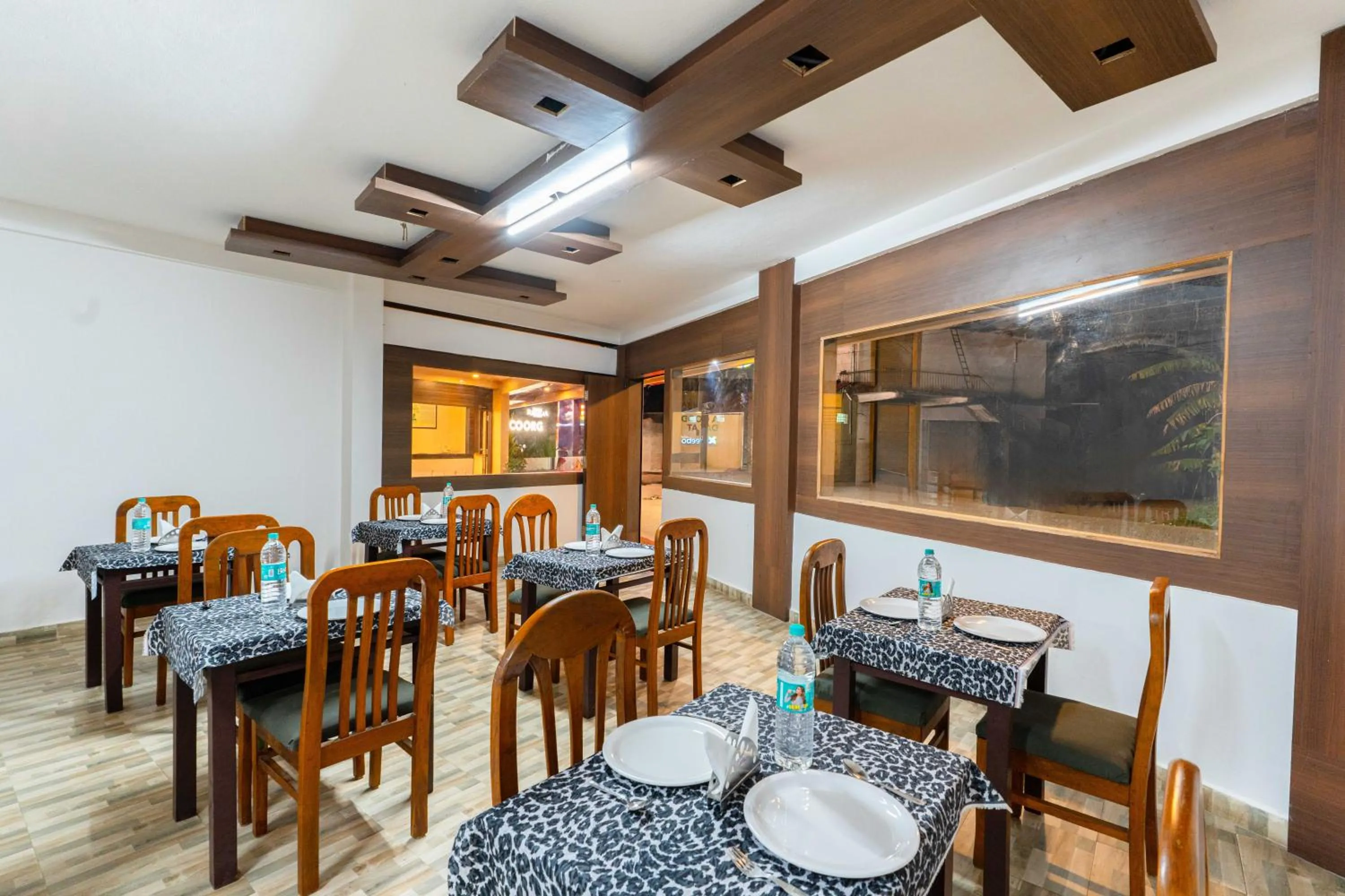 Dining area in Treebo Regalia Comforts, 15 Mins From Abbey Waterfall