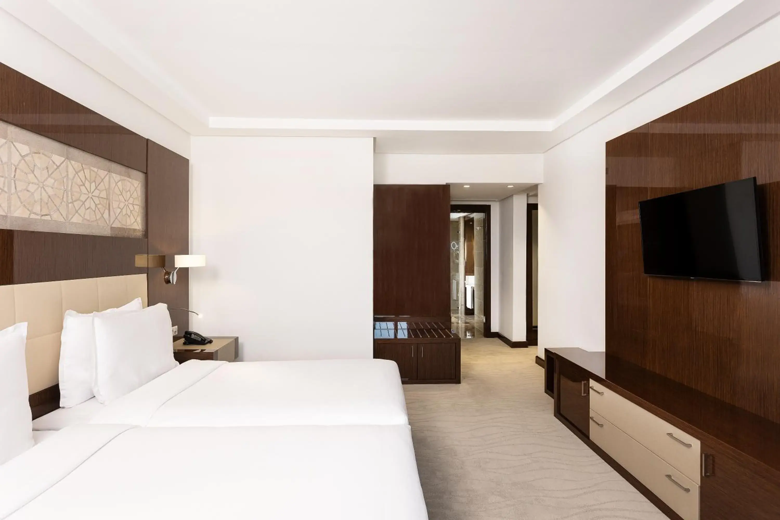 Communal lounge/ TV room, Bed in Radisson Blu Hotel & Convention Center, Tunis Communal lounge/ TV room, Bed in Radisson Blu Hotel & Convention Center, Tunis