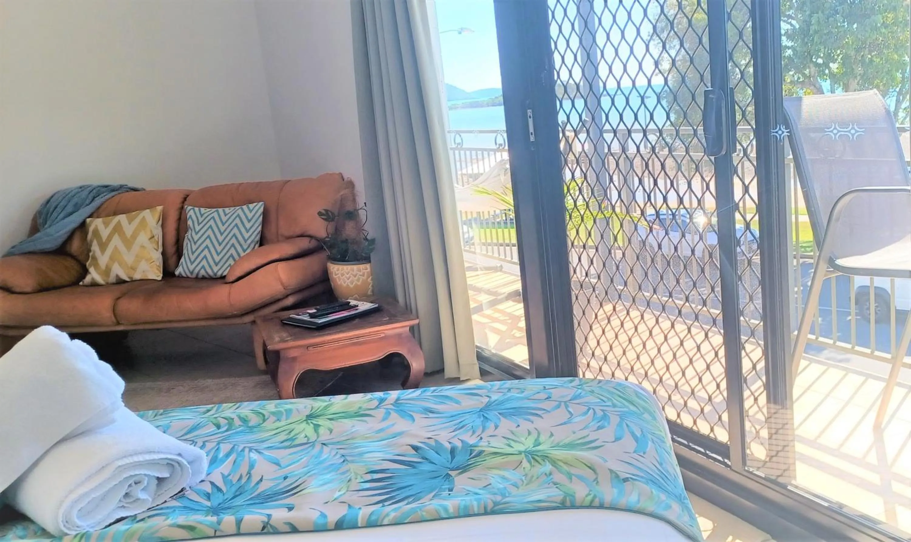 Seating area, Bed in Whitsunday Waterfront Apartments