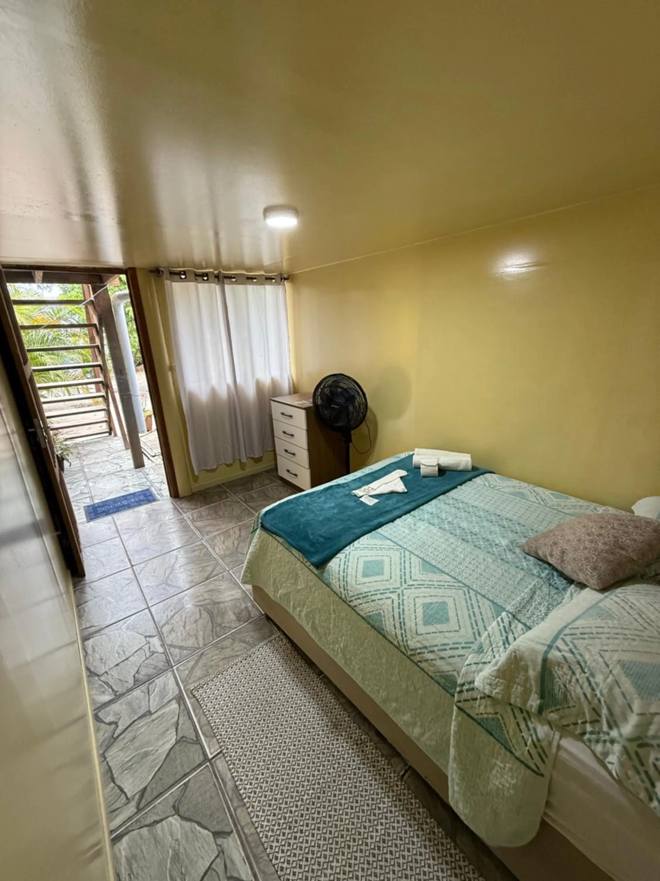 Bed in Pousada & Camping Tubarão