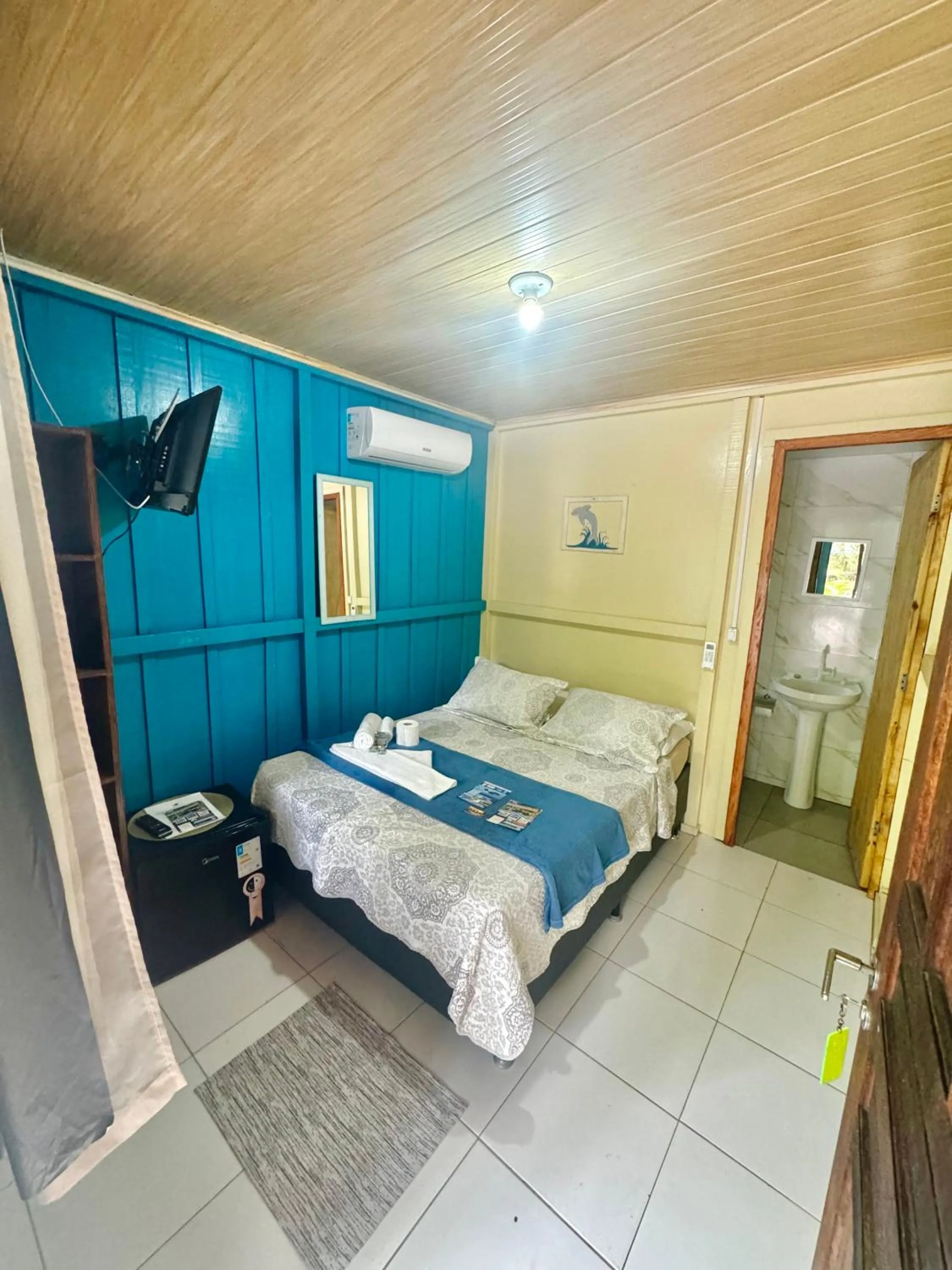 Bed in Pousada & Camping Tubarão