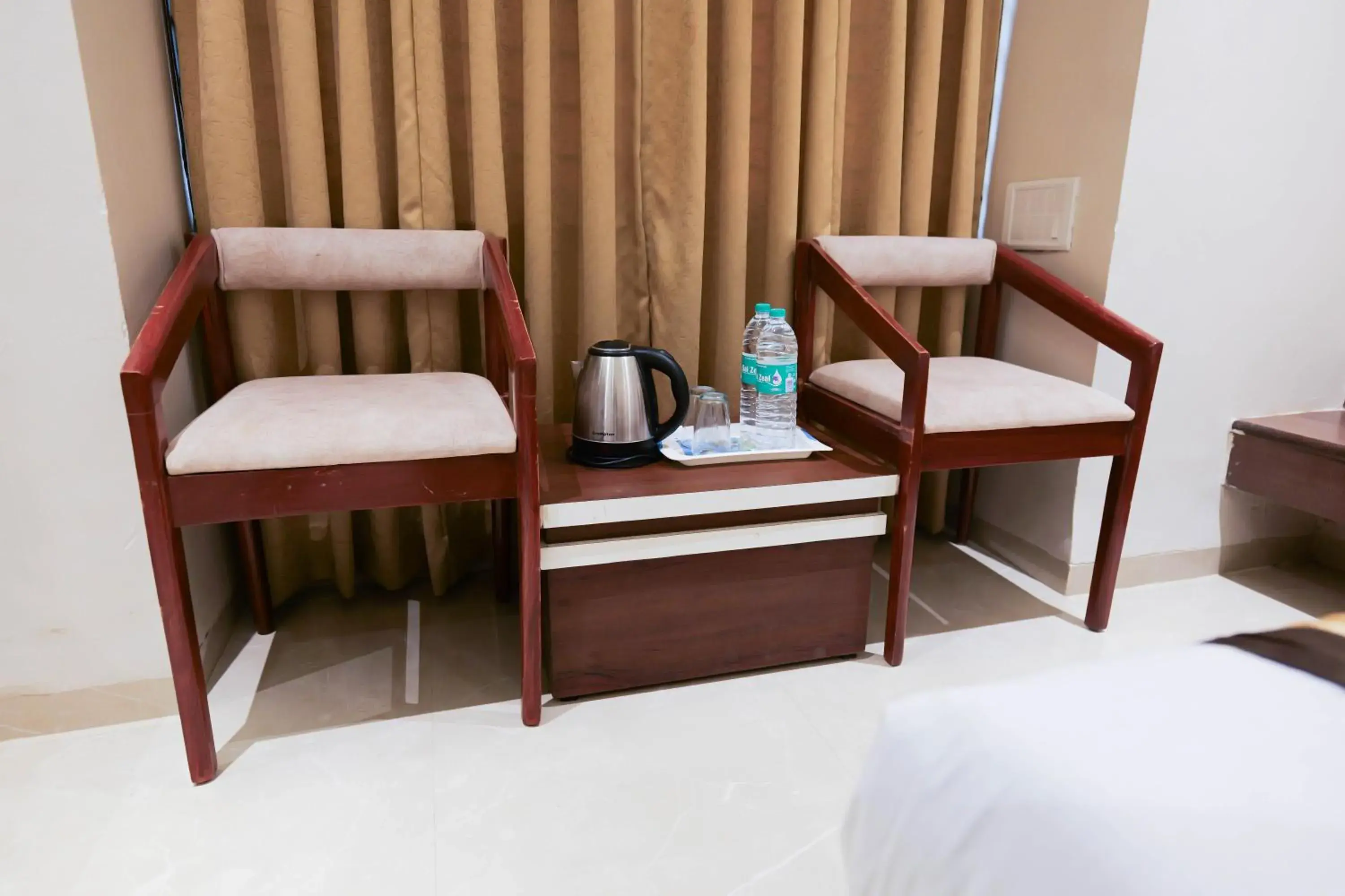 Seating area, Bed in Hotel Laxmibai Palace- Only 300 miter from Sai Baba Temple!!!! Seating area, Bed in Hotel Laxmibai Palace- Only 300 miter from Sai Baba Temple!!!!