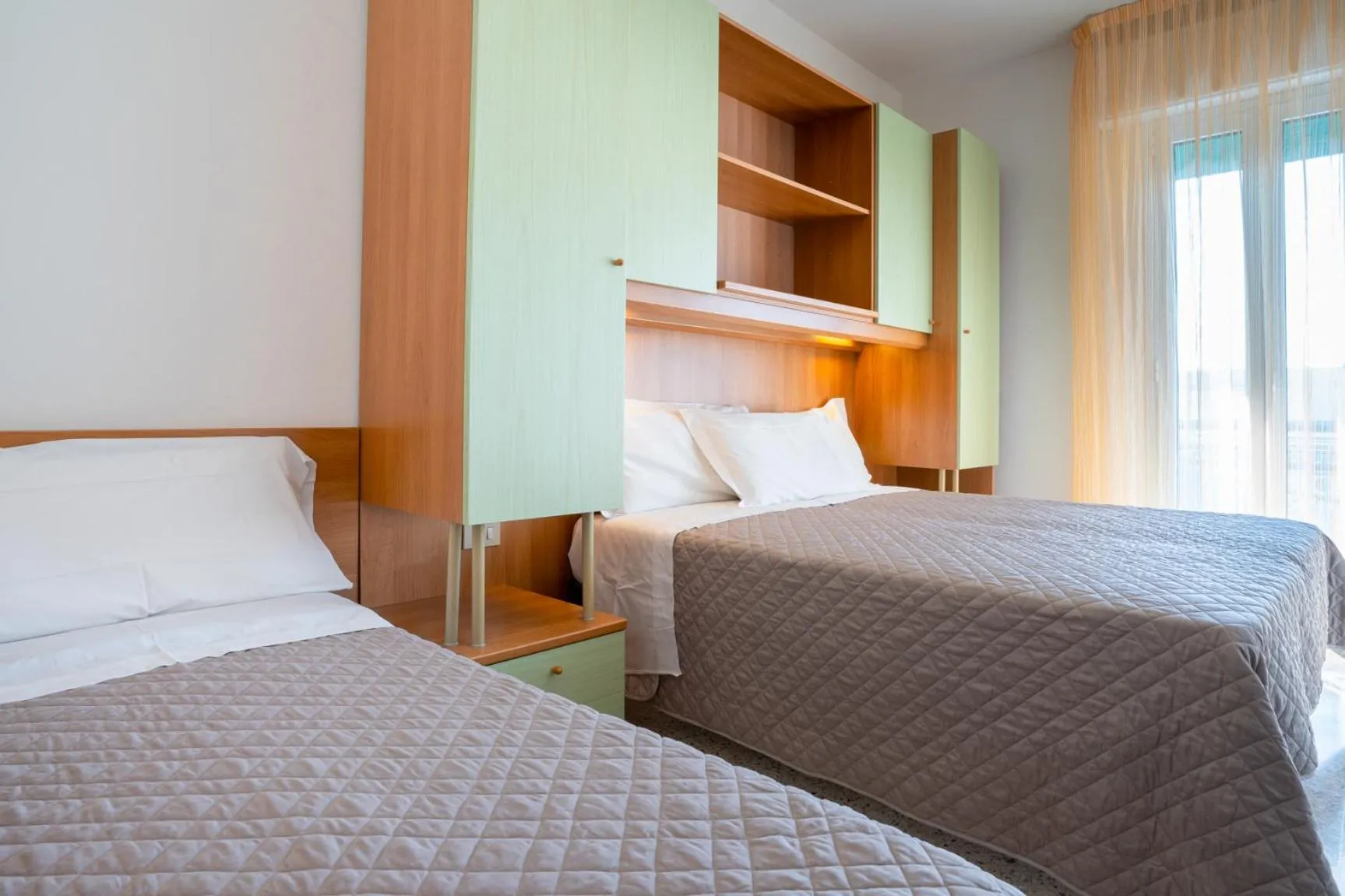 Bed in Hotel Dolomiti