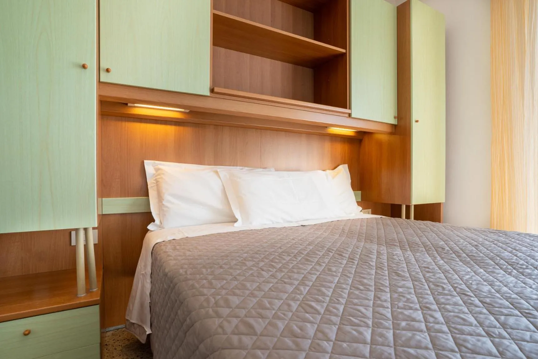 Bed in Hotel Dolomiti