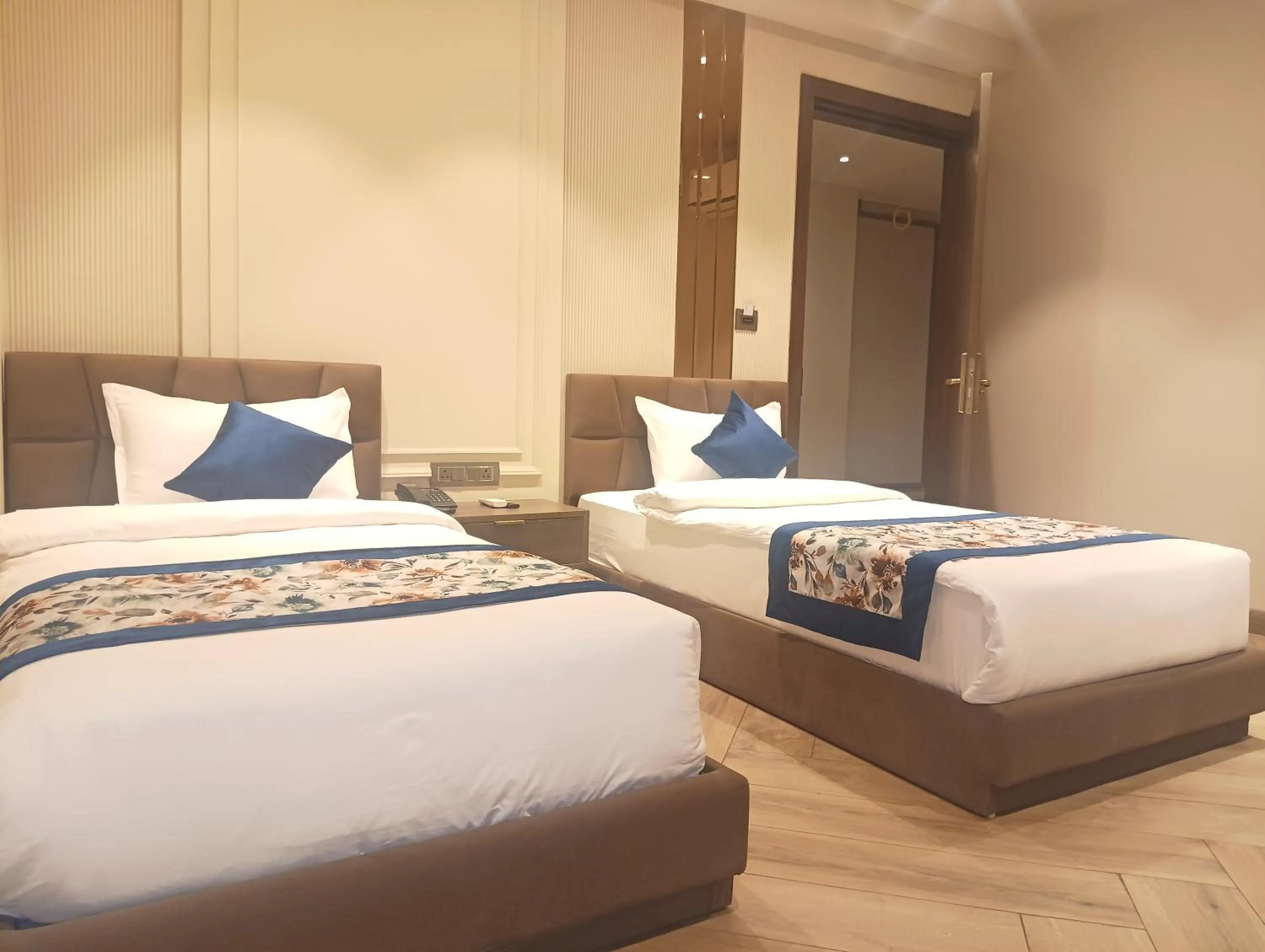 Bed in Qotel Signature Coleman Janakpuri