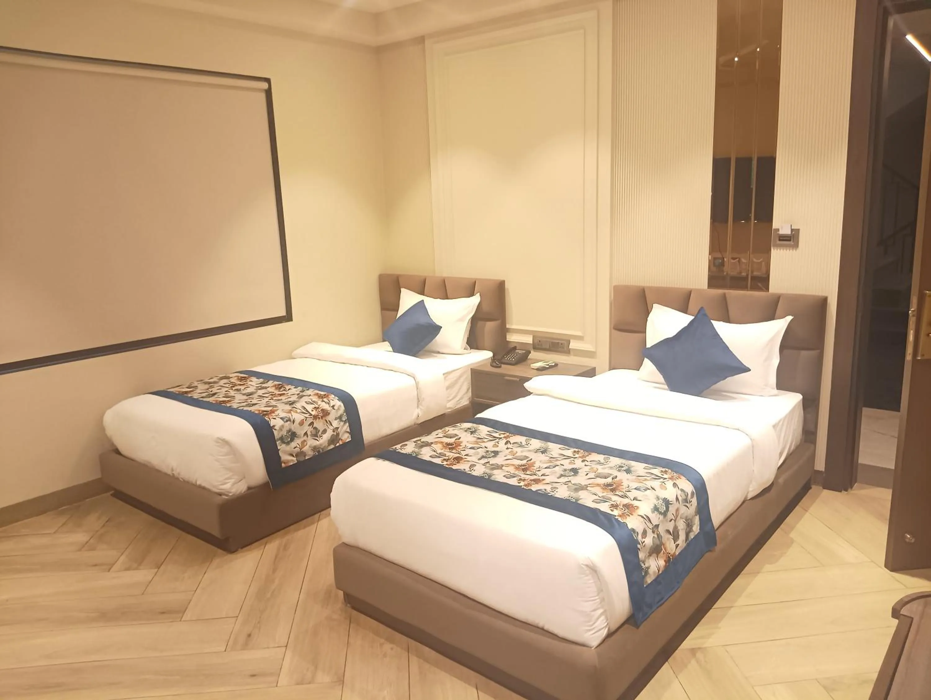 Bed in Qotel Signature Coleman Janakpuri