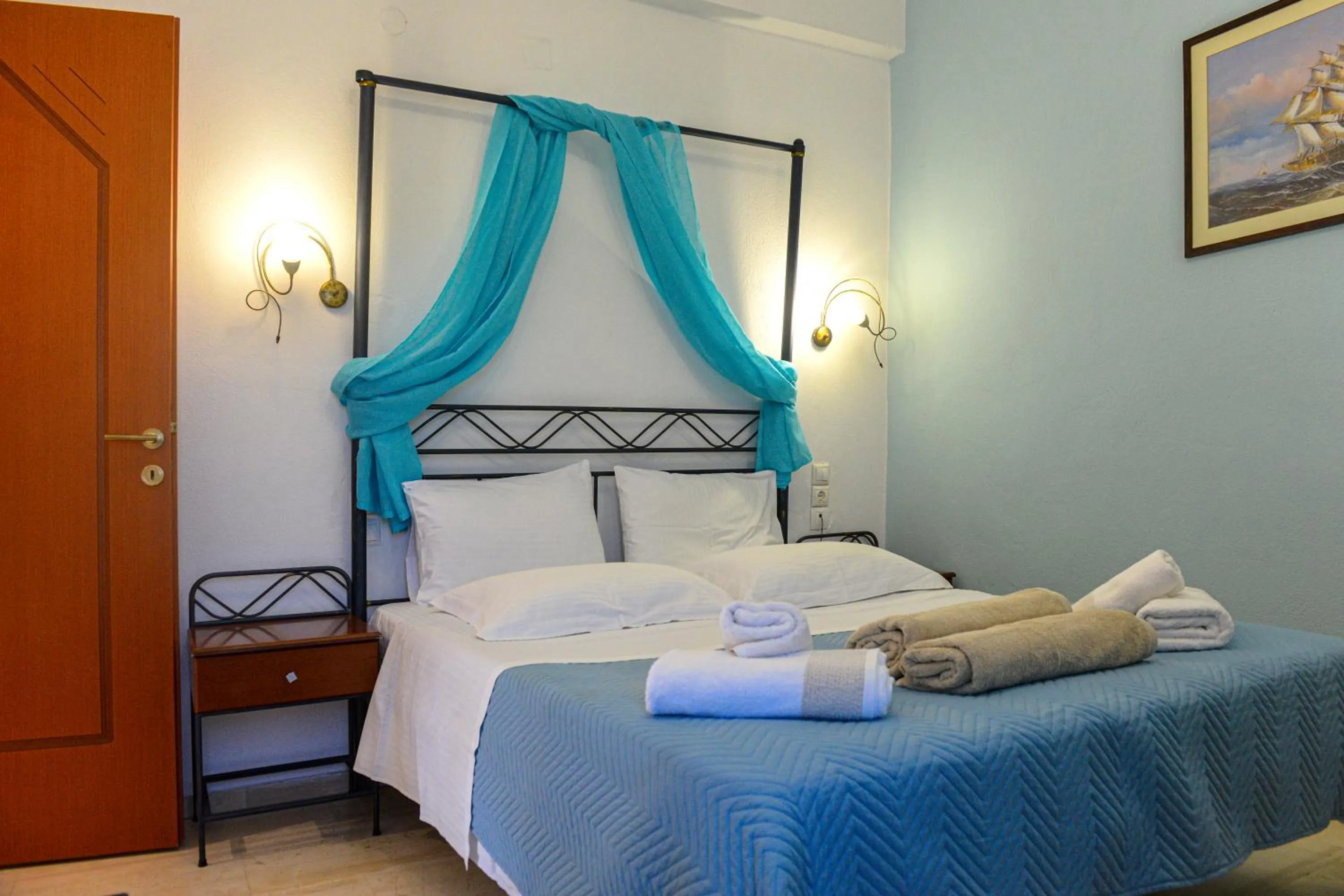 Bed in Skiathos Island Suites