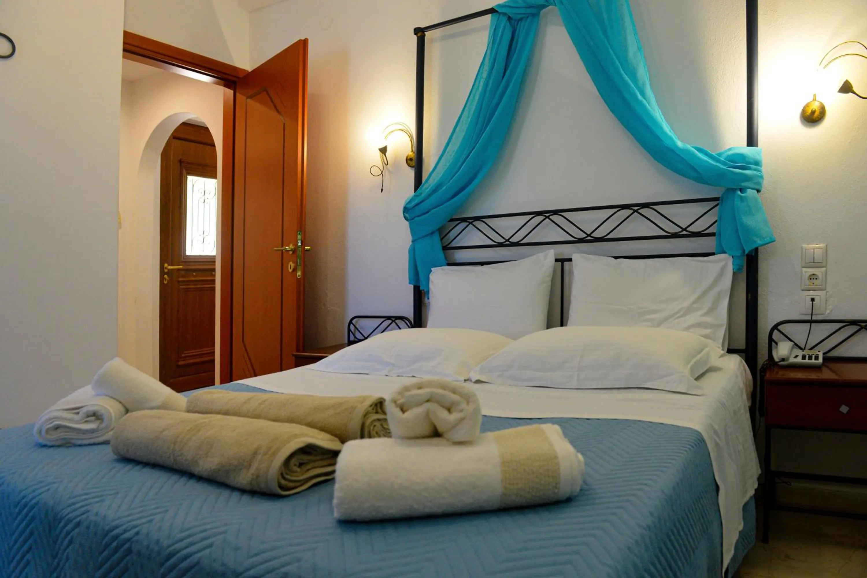 Bed in Skiathos Island Suites