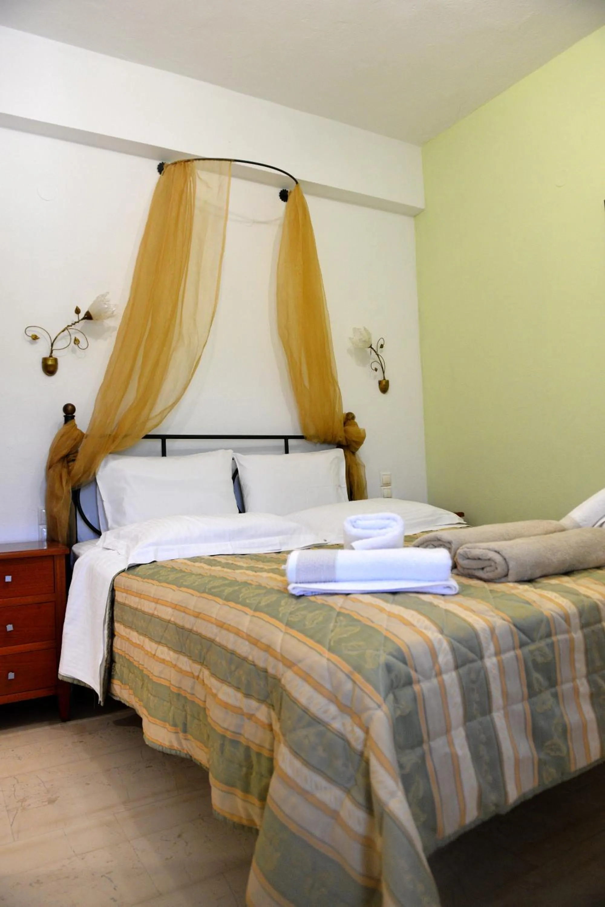 Bed in Skiathos Island Suites
