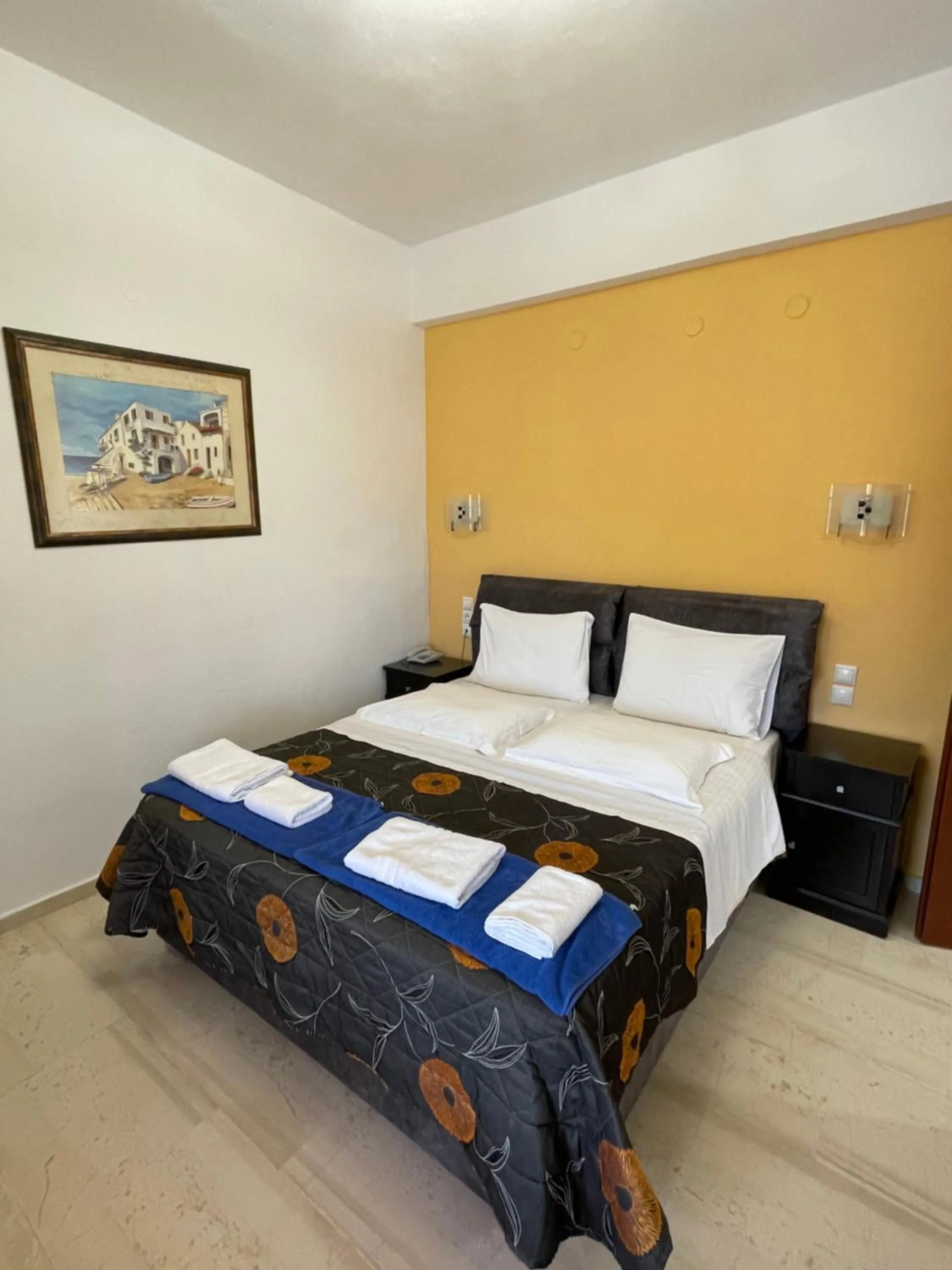 Bed in Skiathos Island Suites