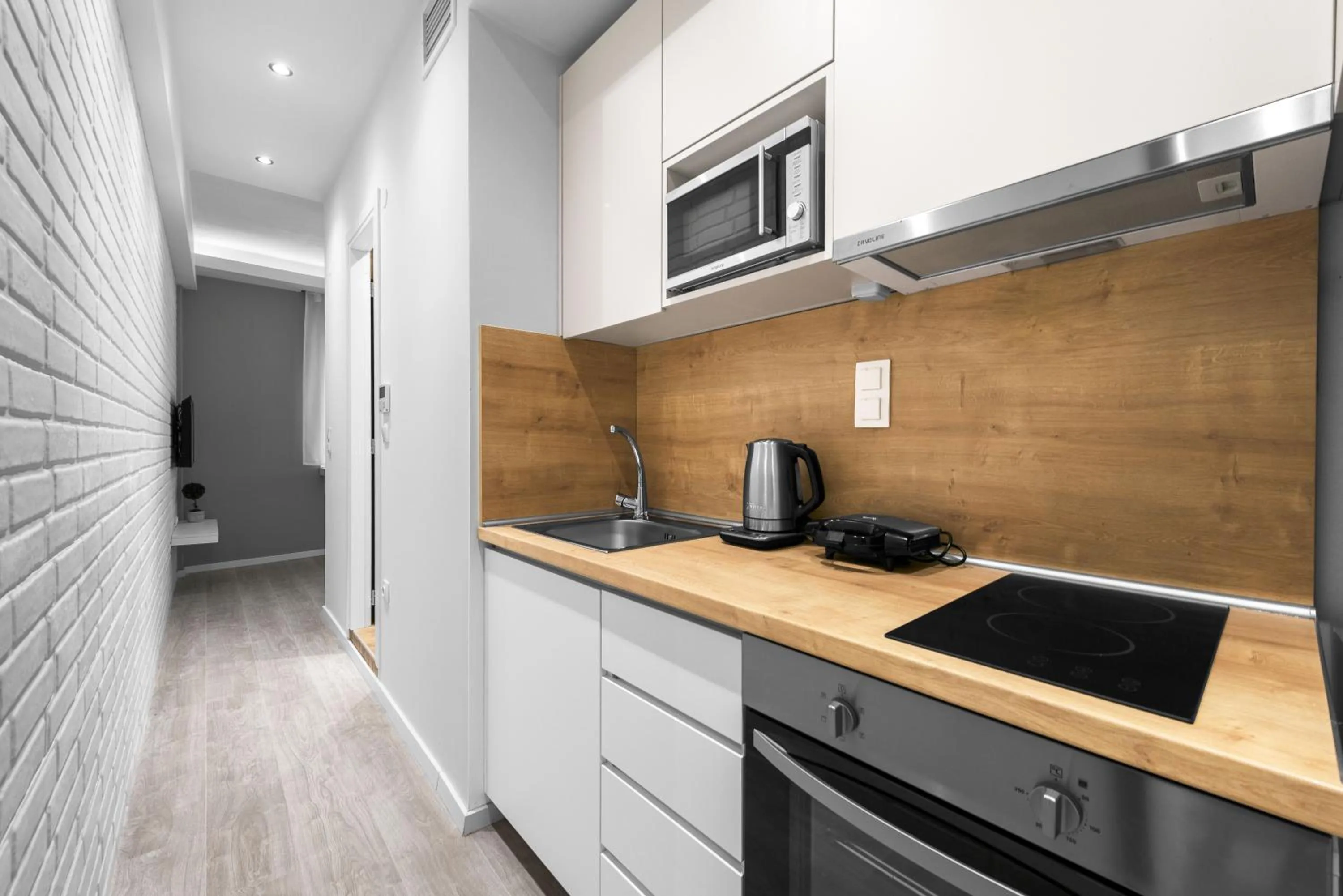 Kitchen or kitchenette in DeniZen Boutique Apartments, Nilie Hospitality MGMT