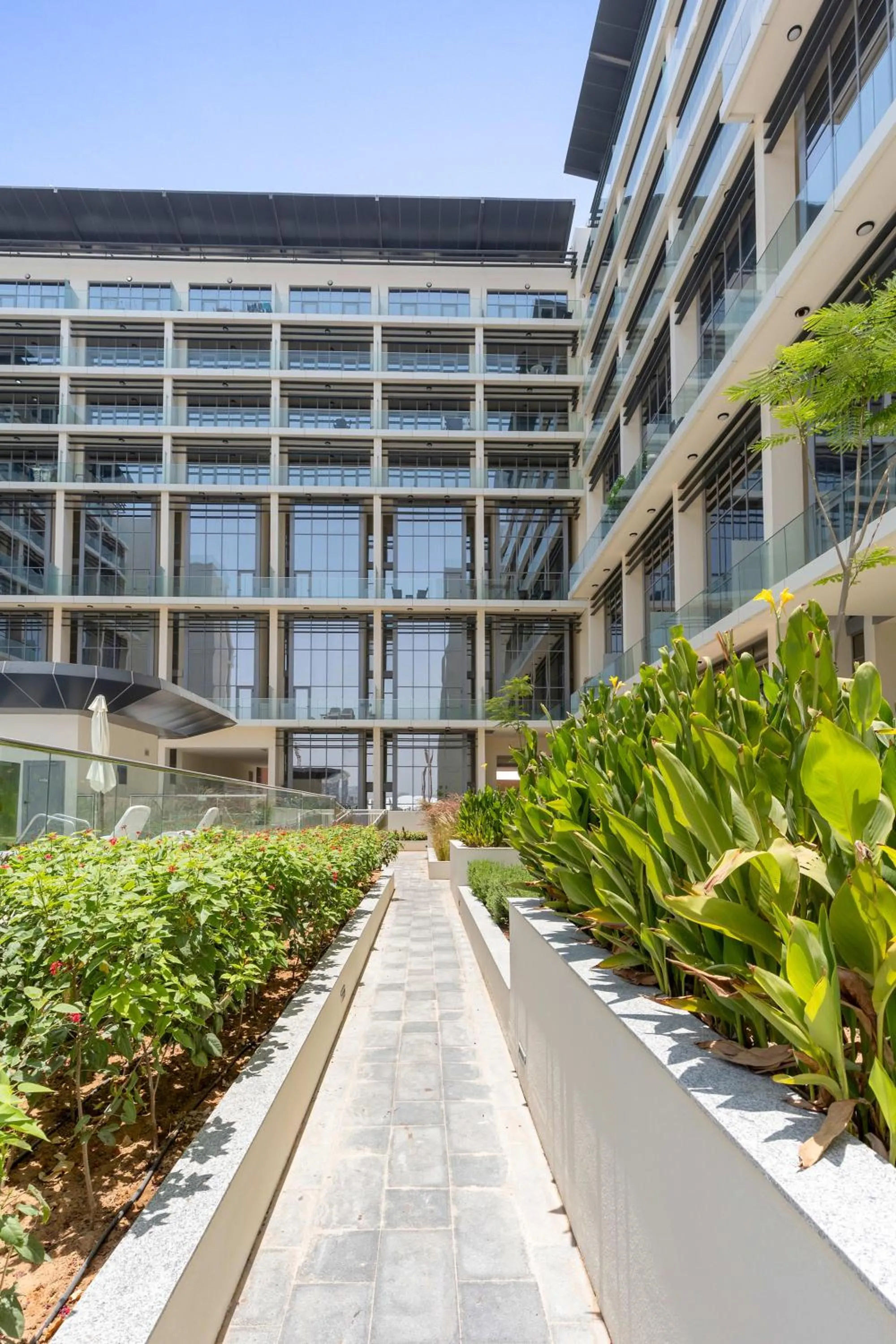Property building in Silkhaus Vacation Homes Modern 1BDR in Oasis Near Masdar City Park