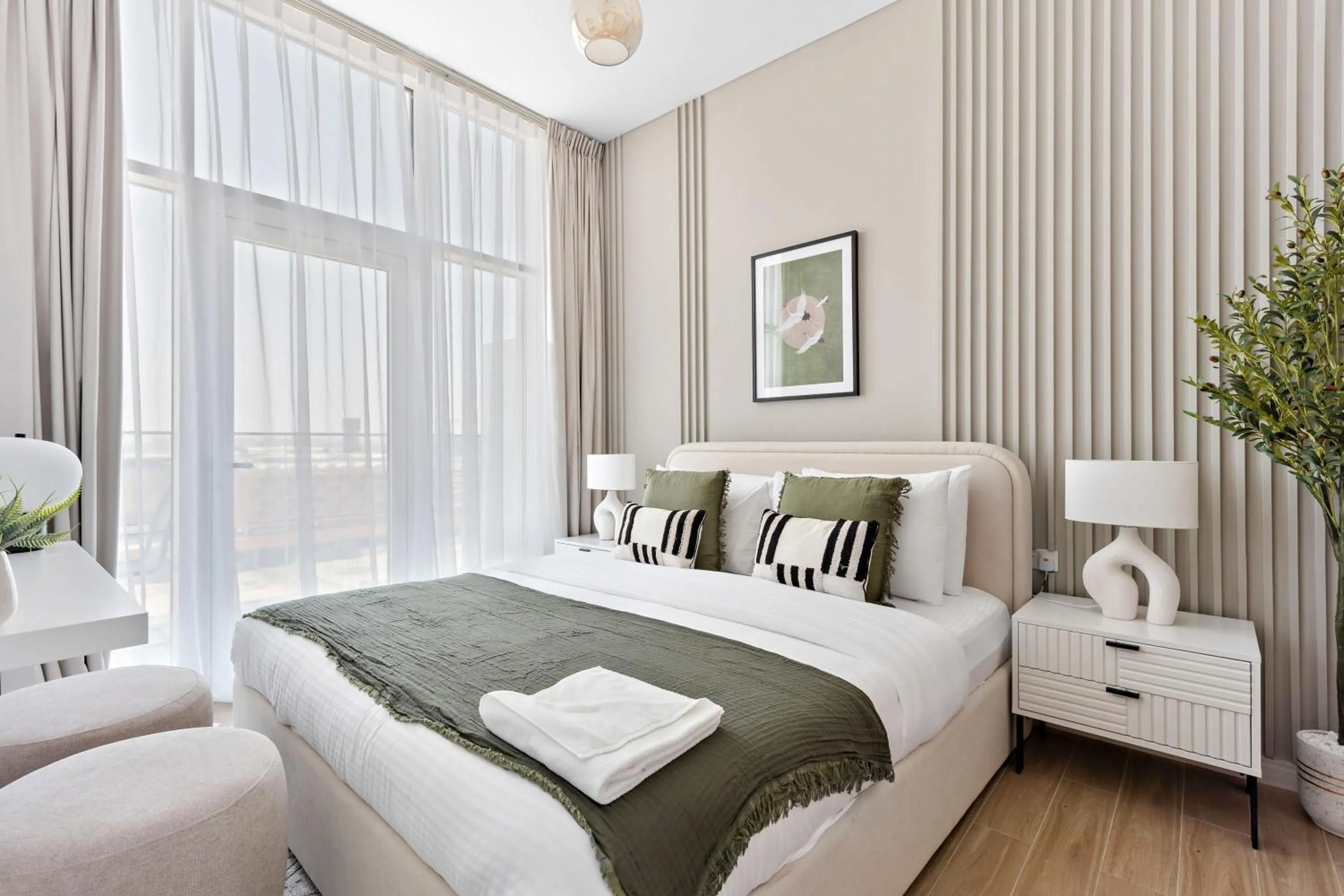 Living room, Bed in Silkhaus Vacation Homes Modern 1BDR in Oasis Near Masdar City Park