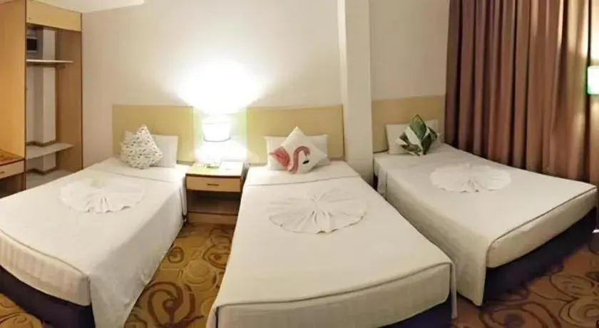 Bed in The Orchid Hotel Bed in The Orchid Hotel