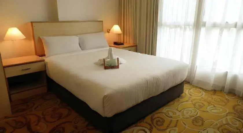 Bed in The Orchid Hotel Bed in The Orchid Hotel