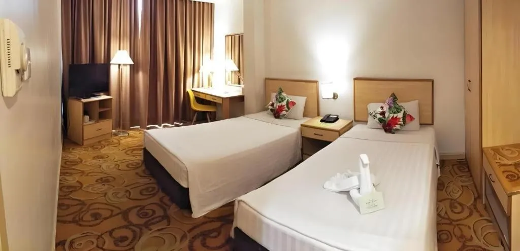 Bed in The Orchid Hotel