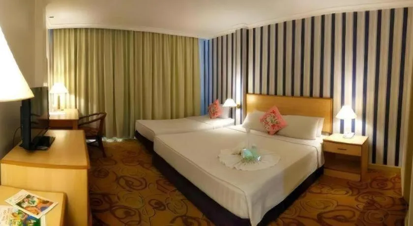 Bed in The Orchid Hotel