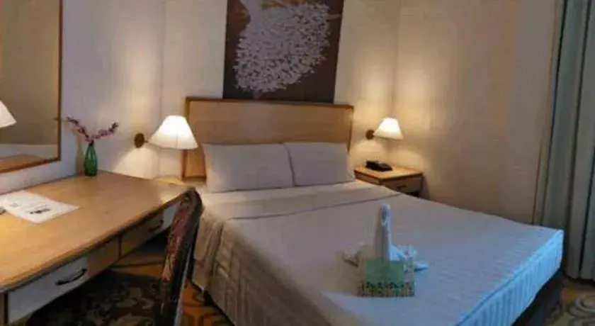 Bed in The Orchid Hotel Bed in The Orchid Hotel