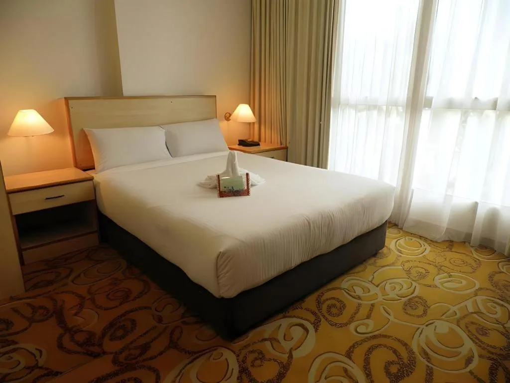 Bed in The Orchid Hotel