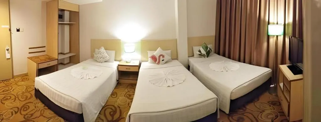 Bed in The Orchid Hotel