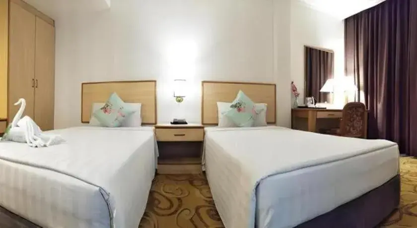 Bed in The Orchid Hotel Bed in The Orchid Hotel