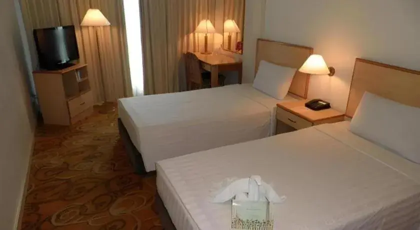 Bed in The Orchid Hotel Bed in The Orchid Hotel