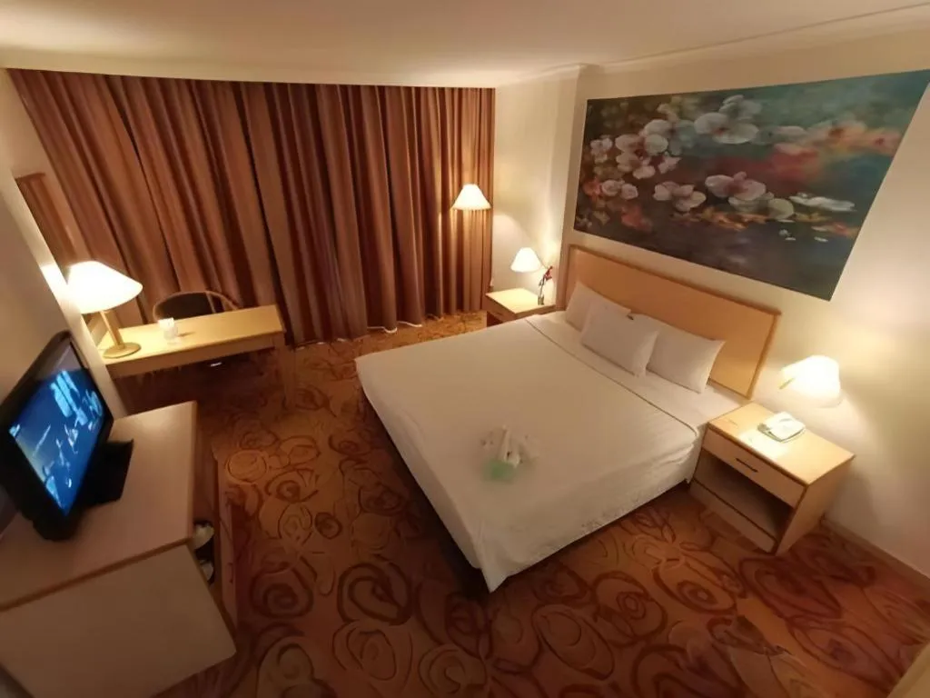 Bed in The Orchid Hotel