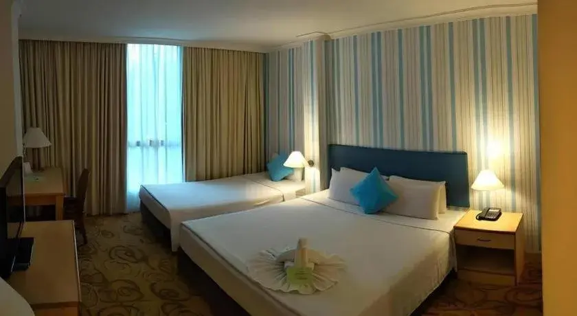 Bed in The Orchid Hotel Bed in The Orchid Hotel