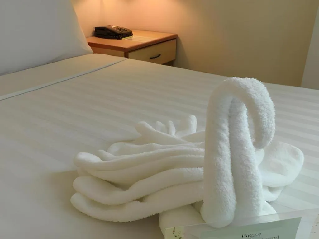 Bed in The Orchid Hotel