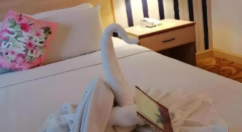 Bed in The Orchid Hotel