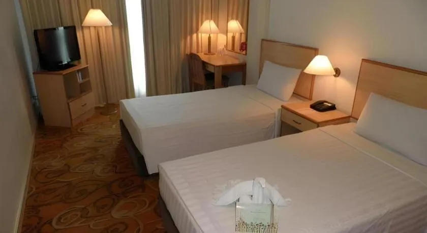 Bed in The Orchid Hotel