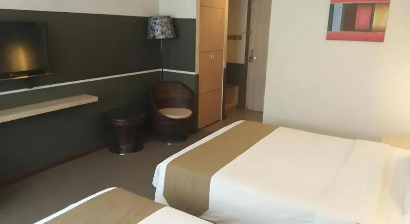 Bed in Grand Medallion Hotel