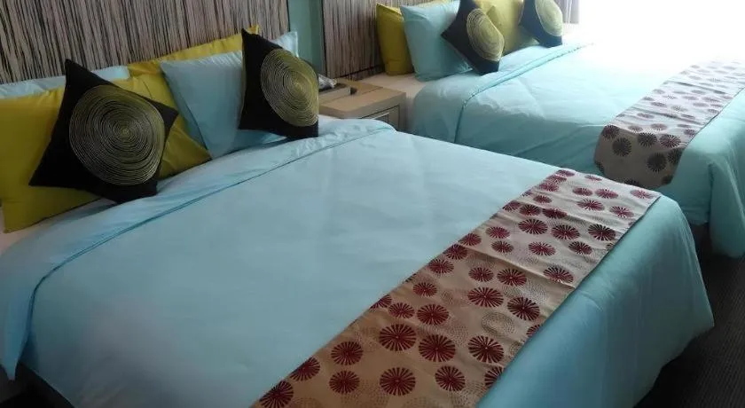Bed in Grand Medallion Hotel